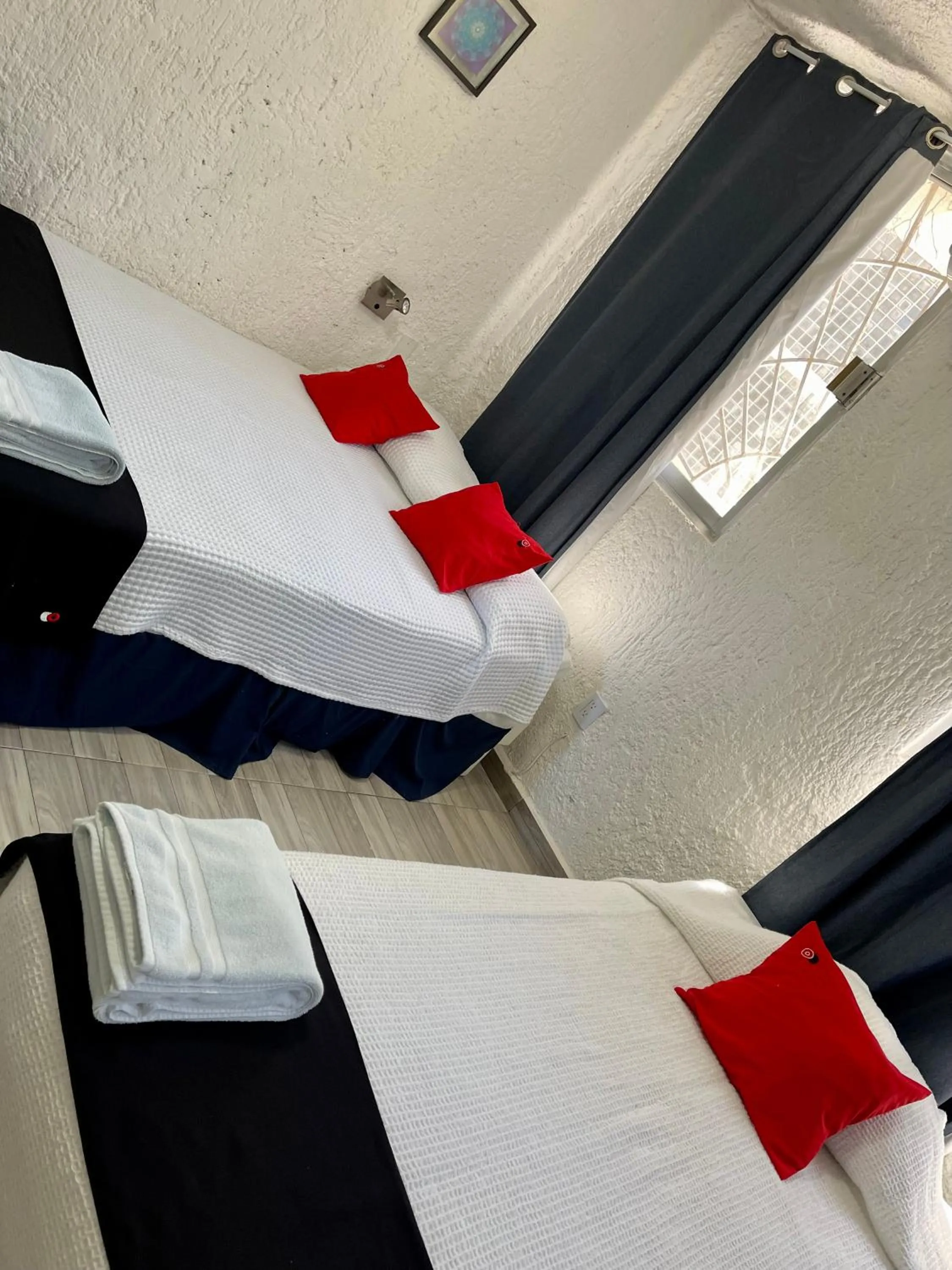 Bed in Hotel Farallon Inn Cancún