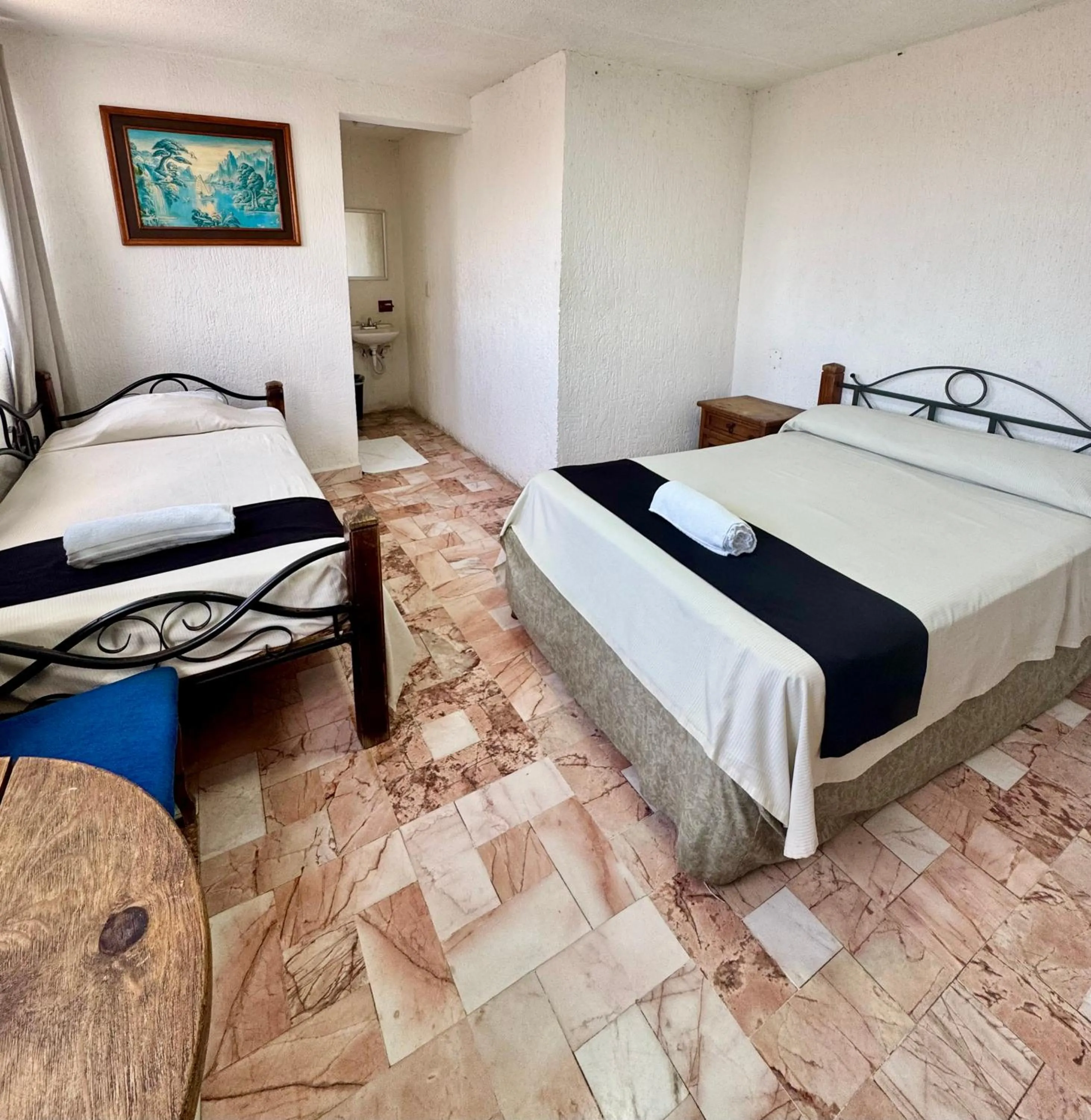 Bed in Hotel Farallon Inn Cancún