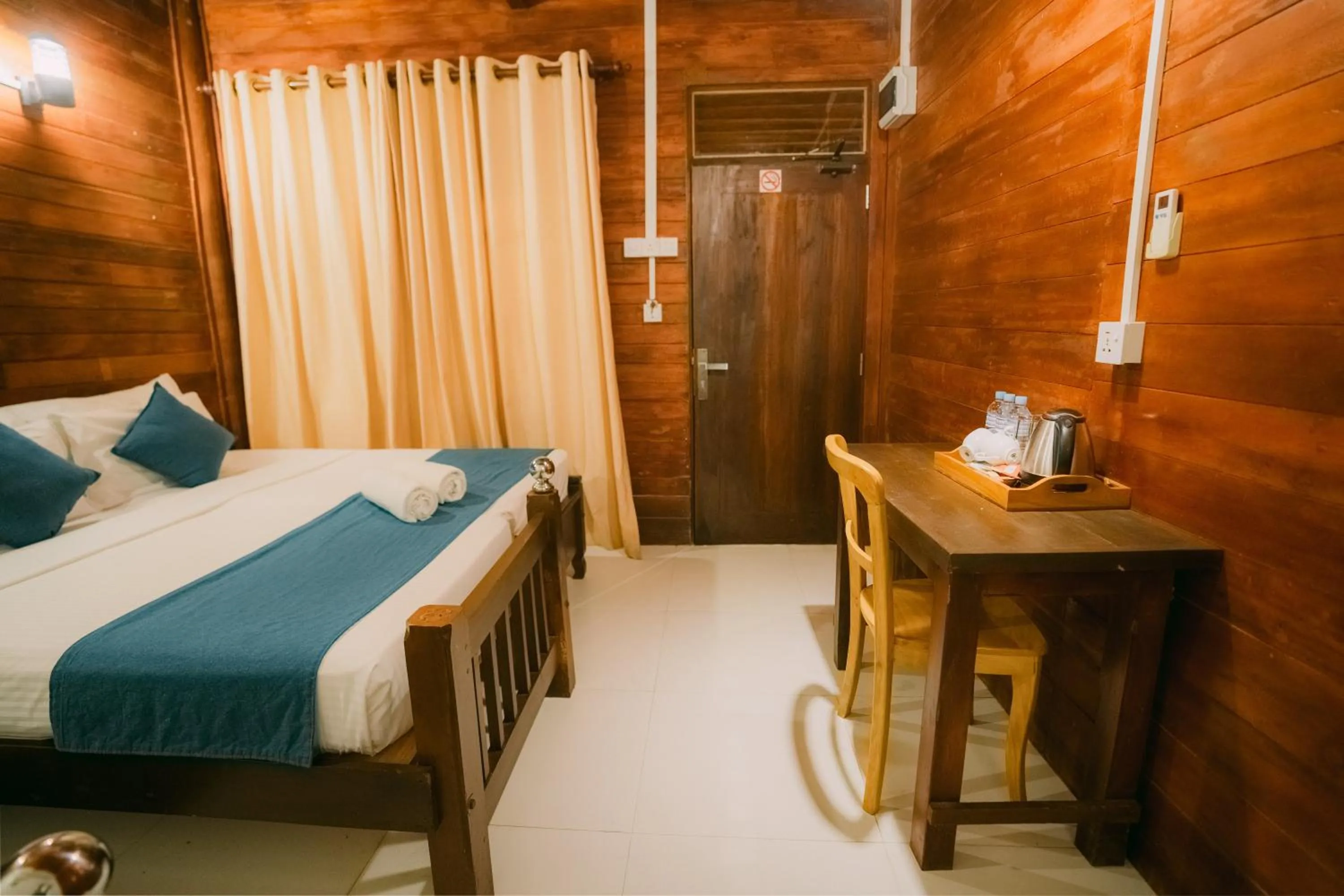 Bed in Coral Beach Hotel