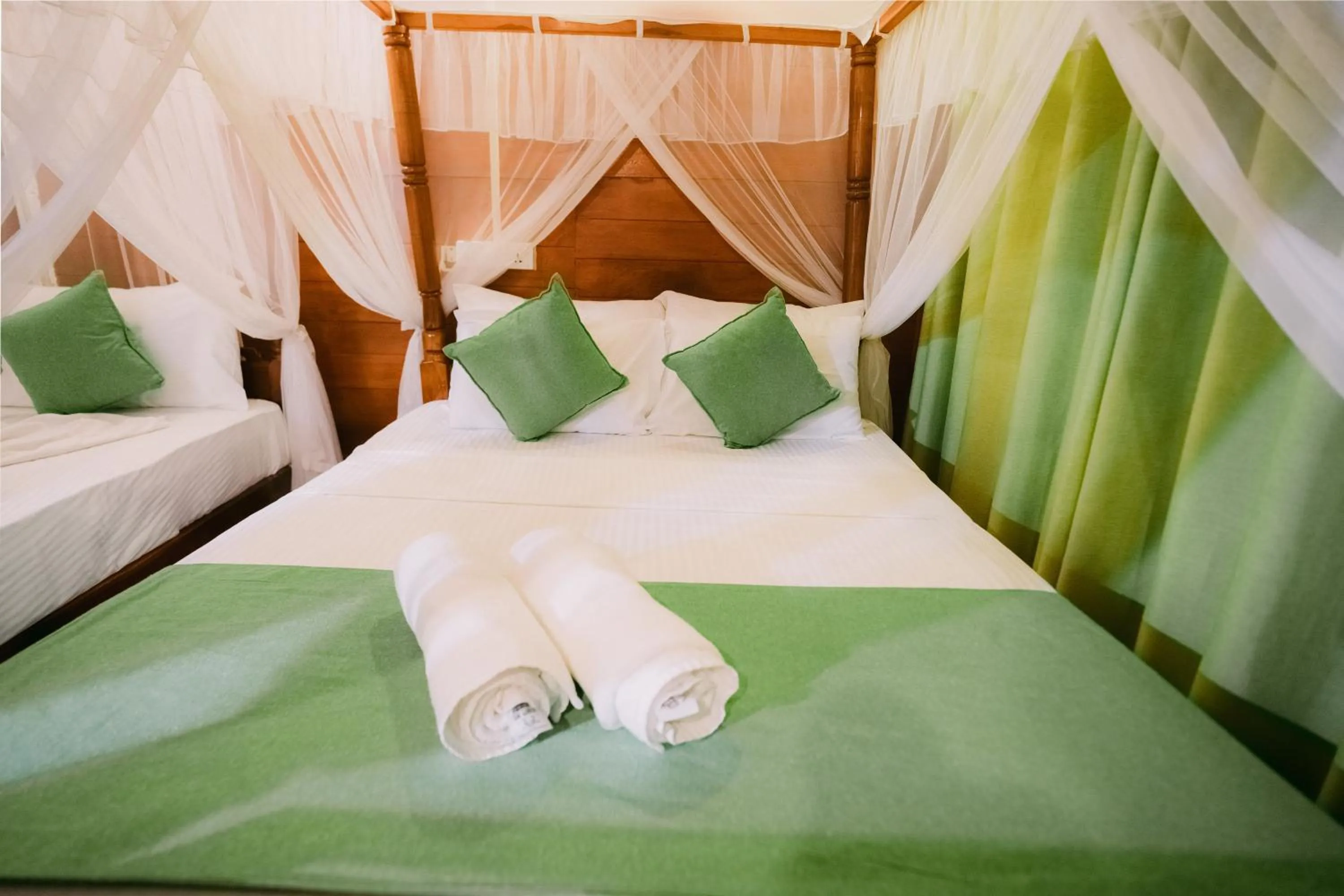 Bed in Coral Beach Hotel