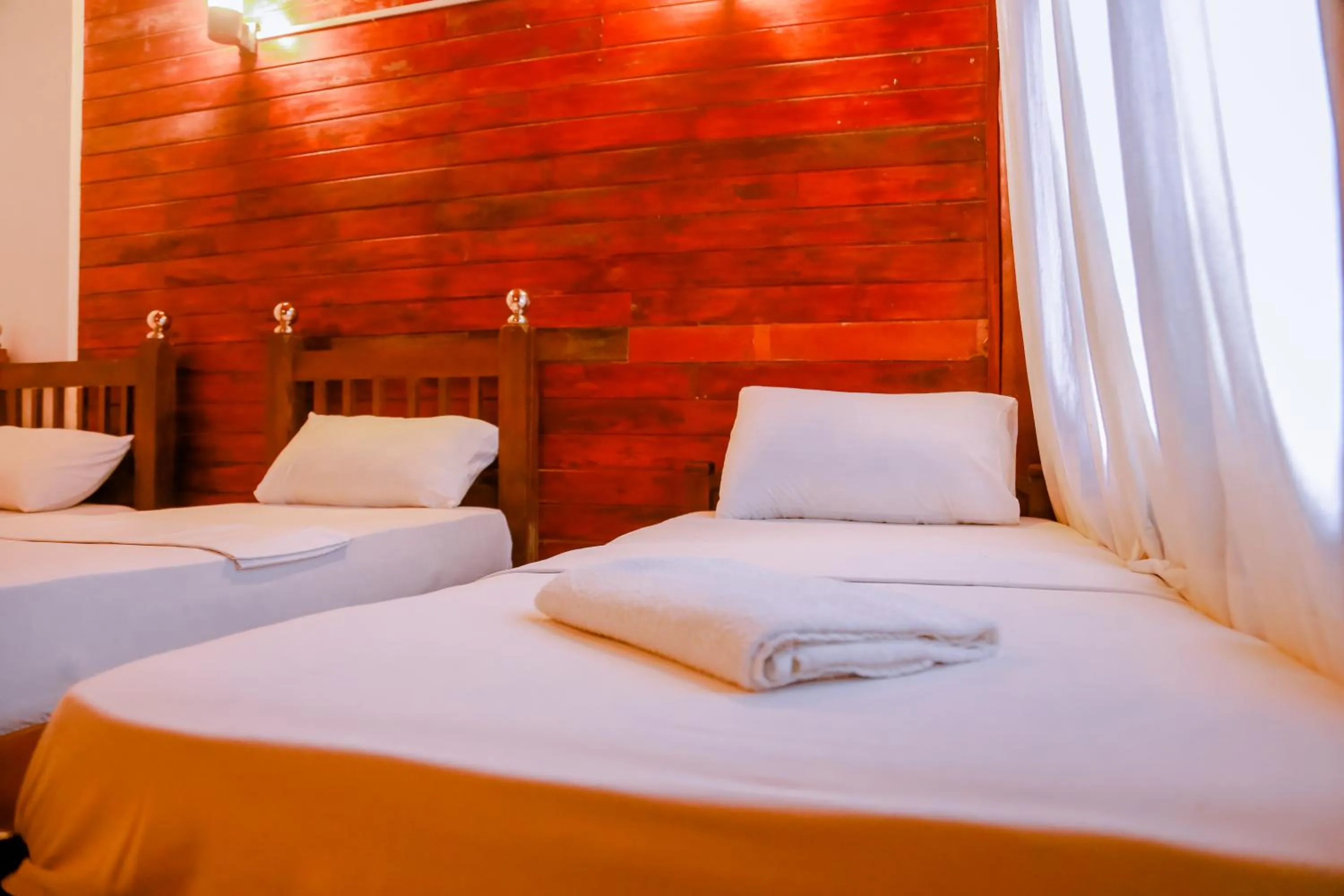 Bed in Coral Beach Hotel