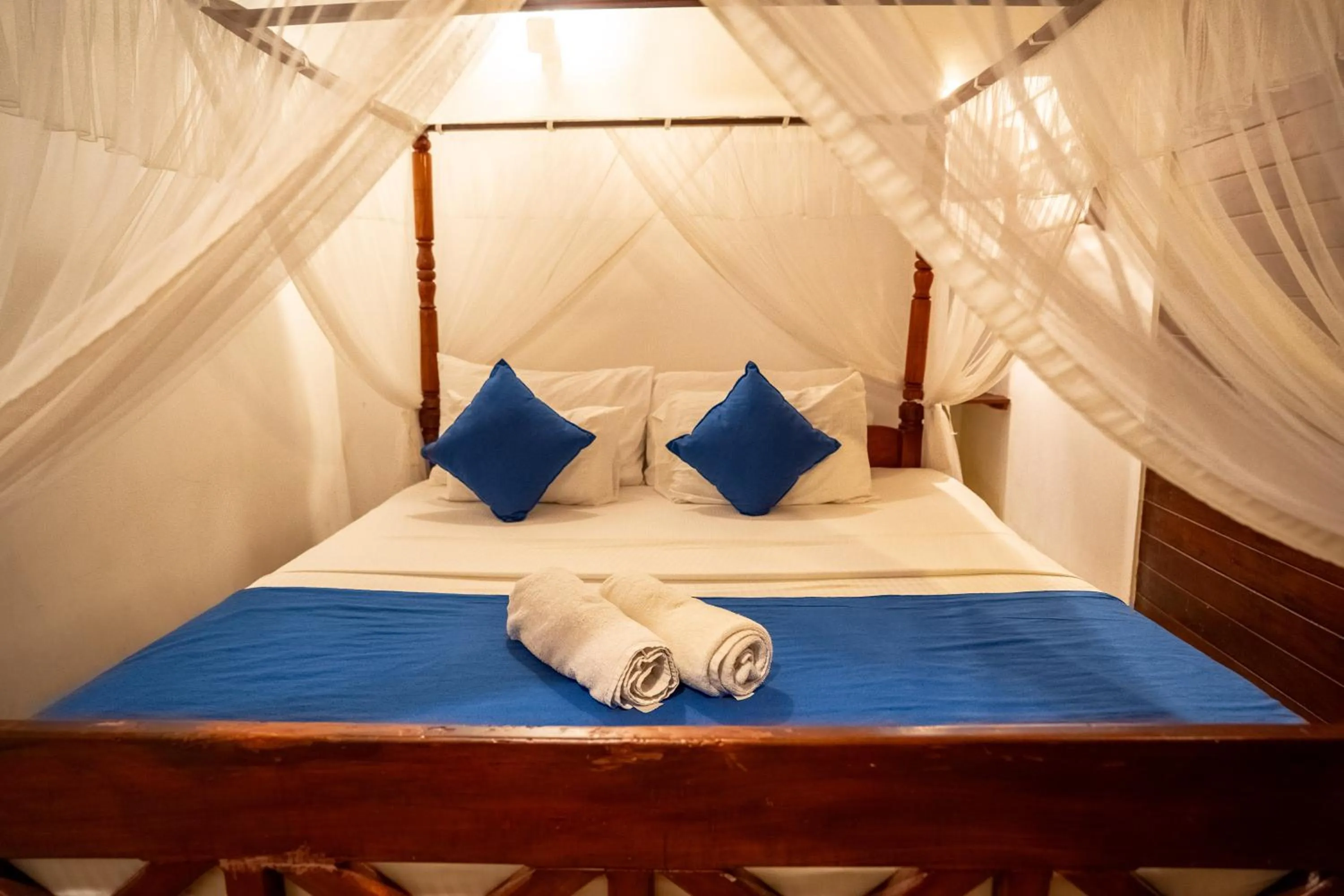 Bed in Coral Beach Hotel