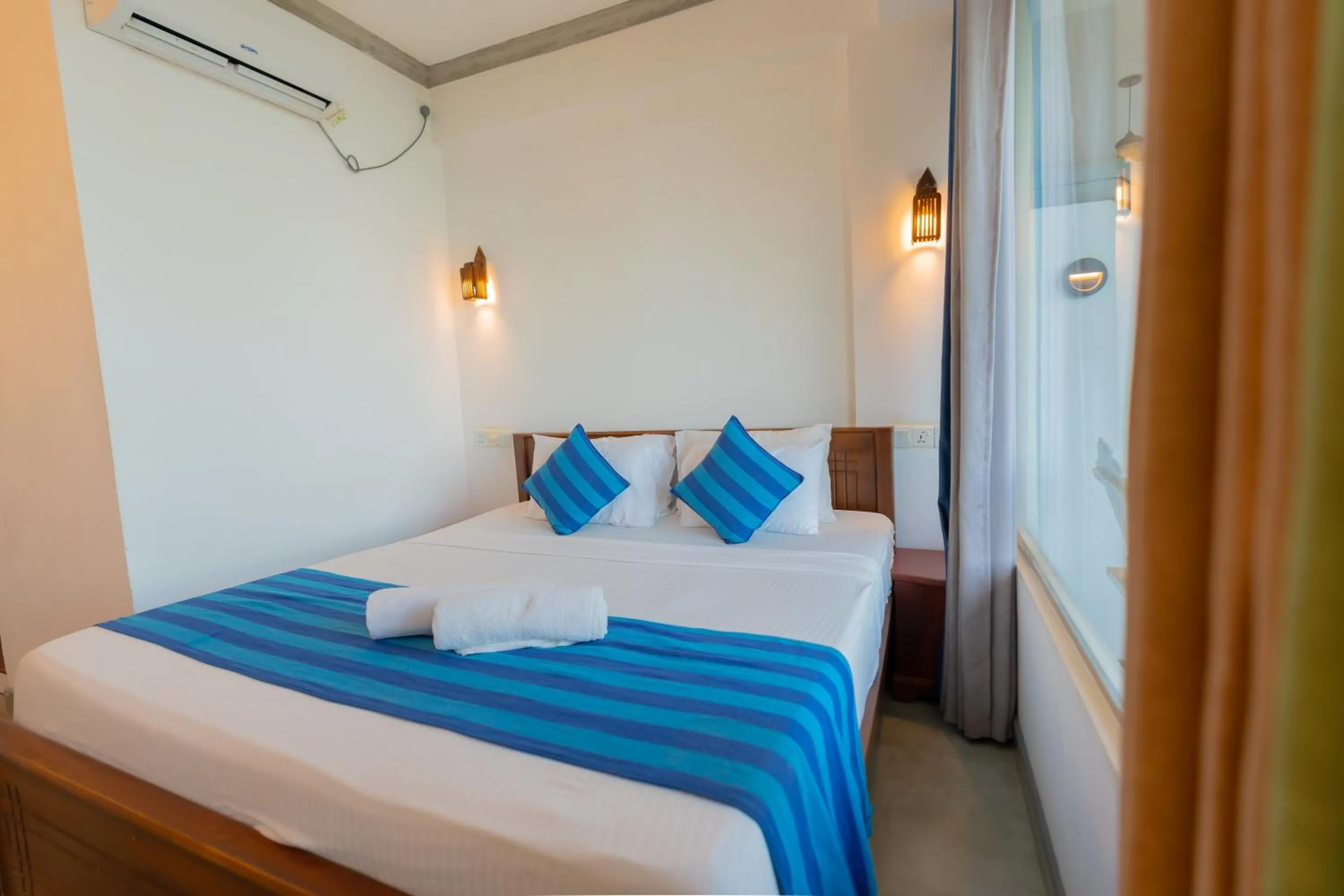 Bed in Coral Beach Hotel