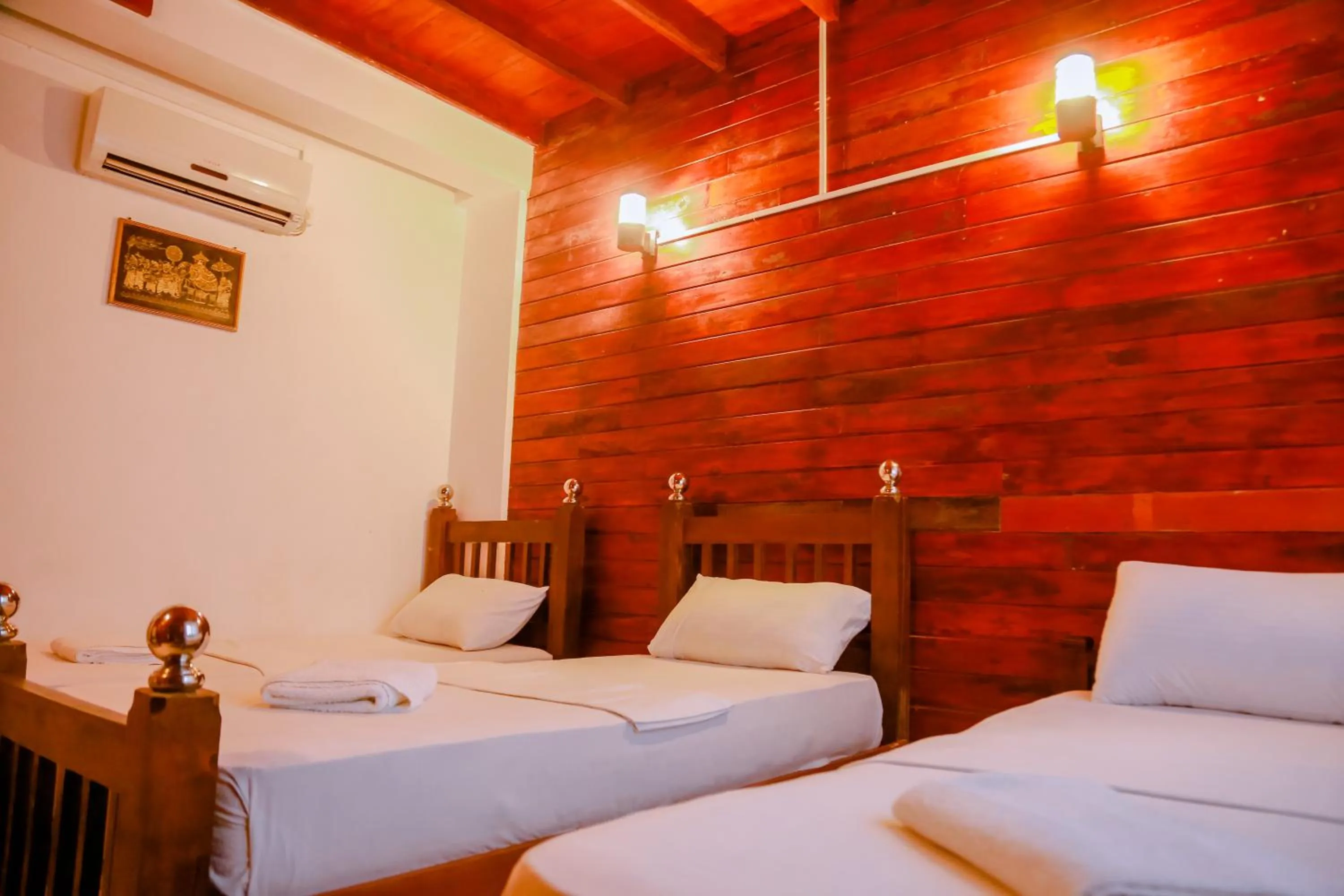 Bed in Coral Beach Hotel