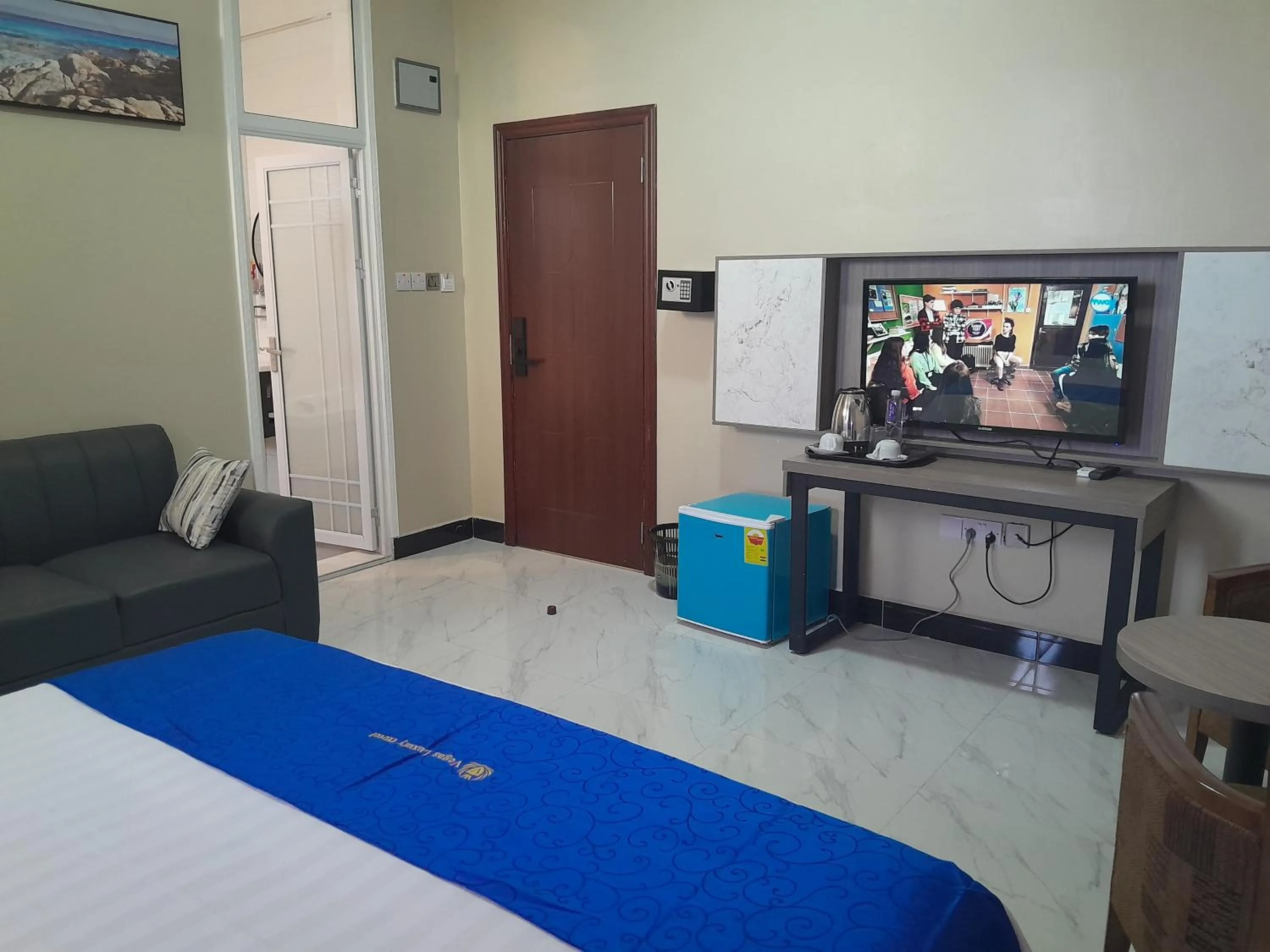 Communal lounge/ TV room, Bed in VEGAS LUXURY HOTEL