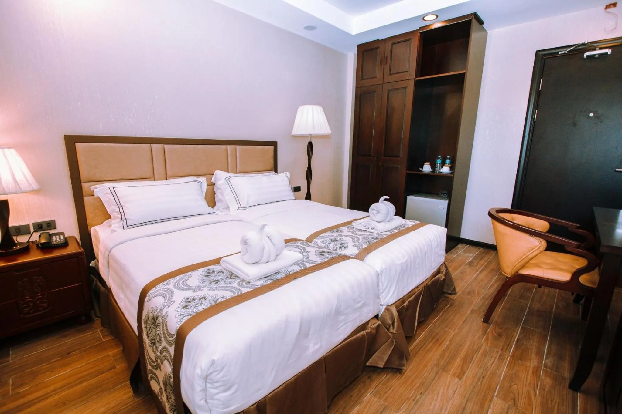 Photo of the whole room, Bed in Palawan Uno Hotel