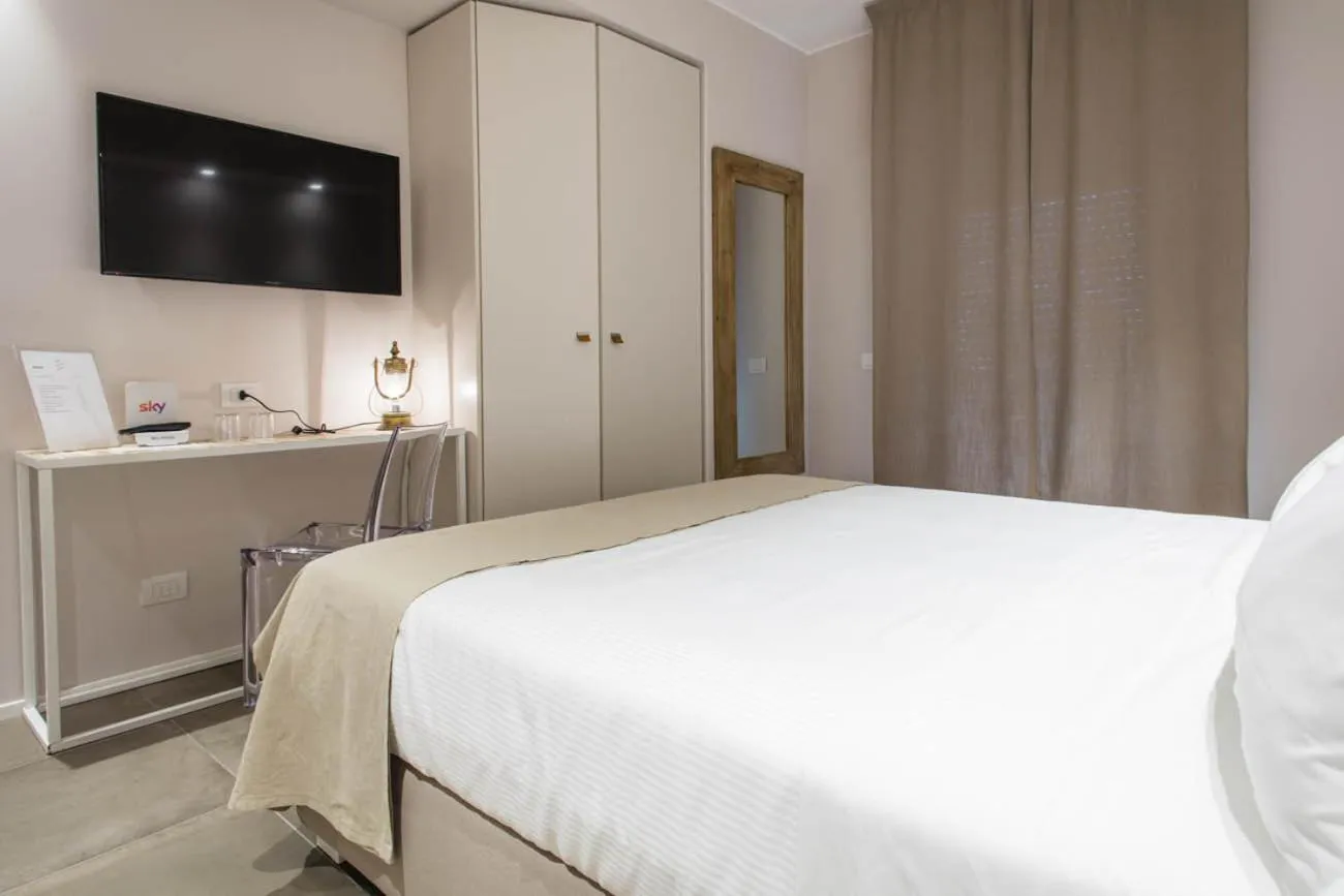 Bed in Manè Boutique Hotel