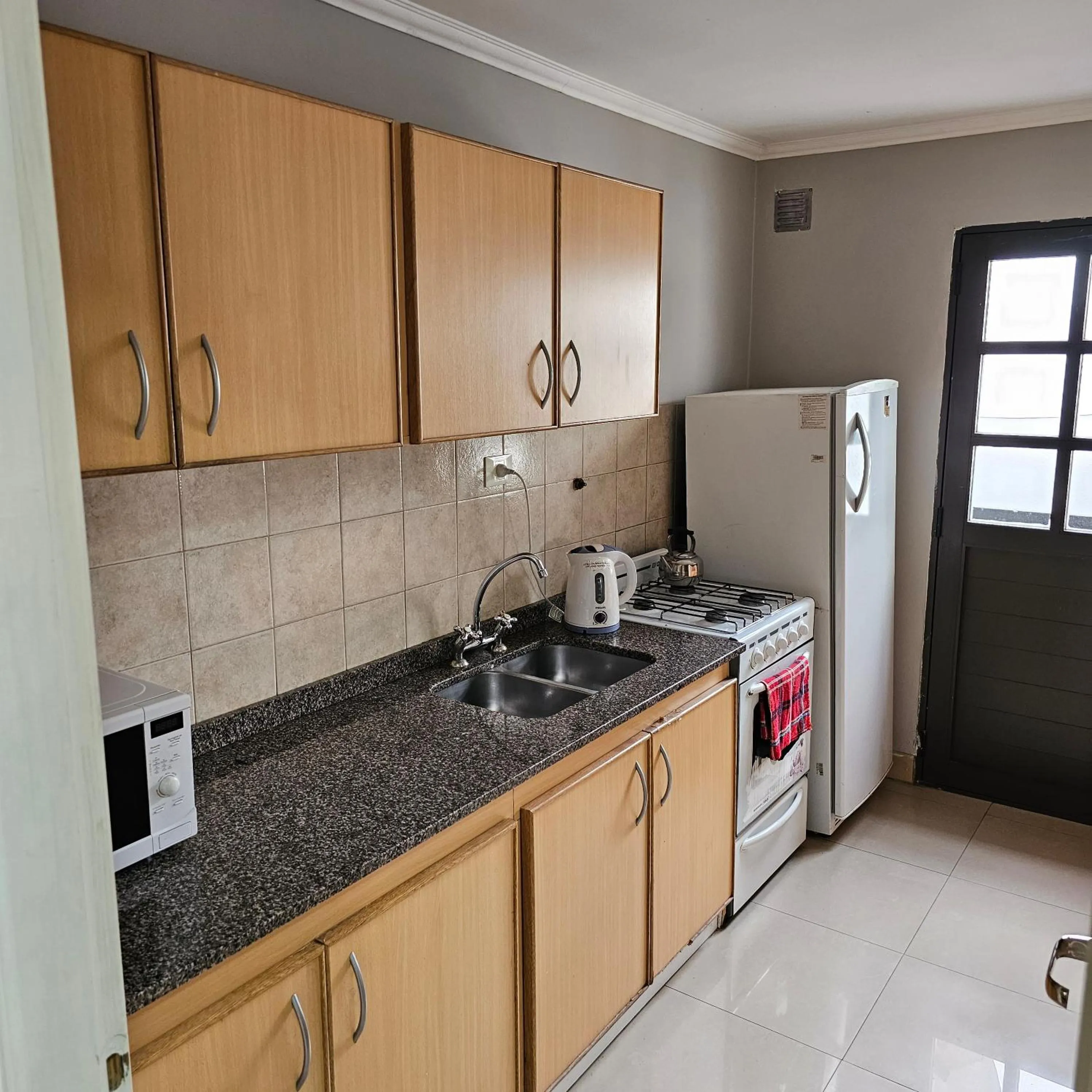 Kitchen or kitchenette in CONDOR Patagonia Aparts