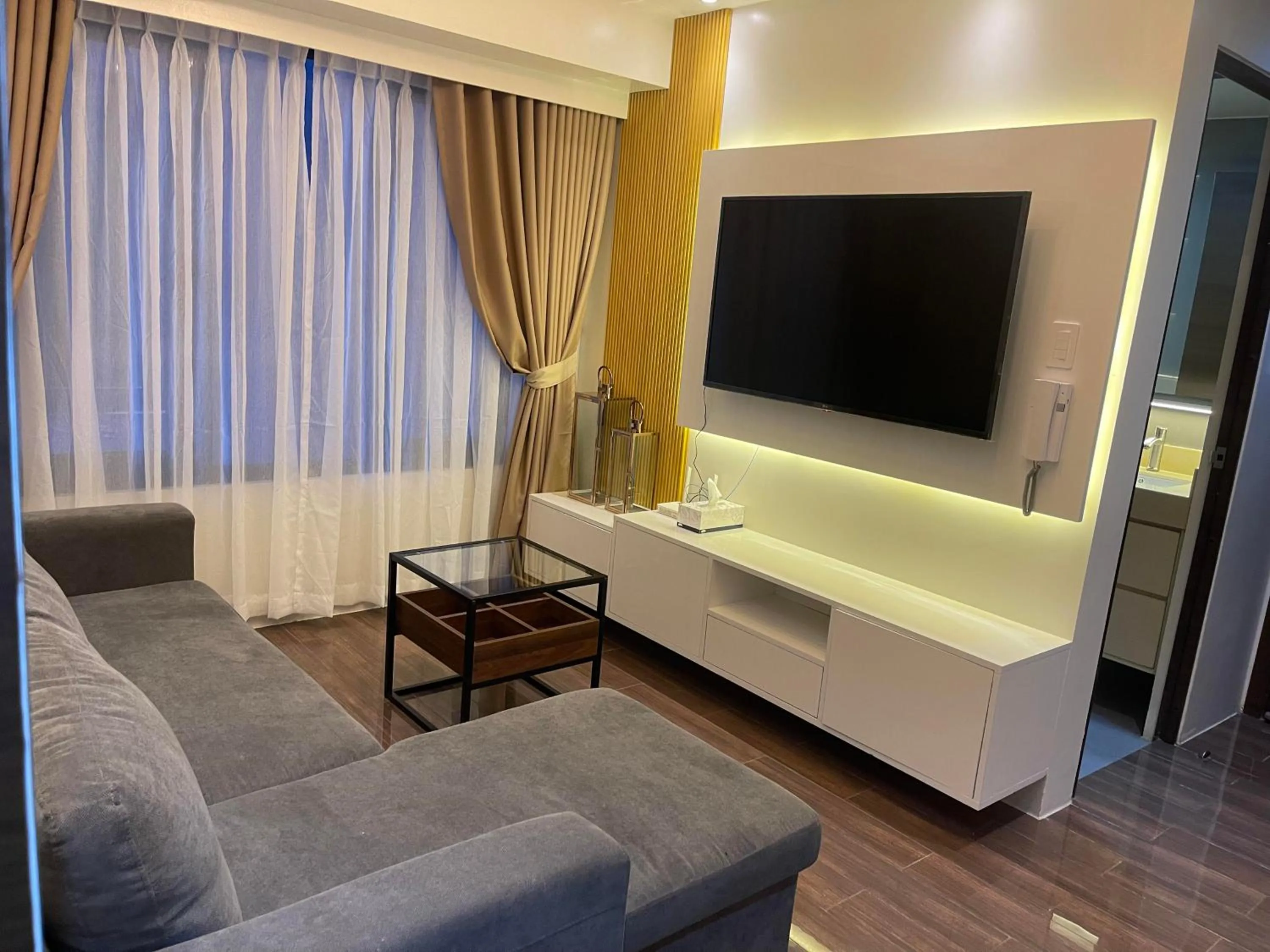 Living room in E & T Homecations 2 Bedroom Apartment at SMDC Air Residences