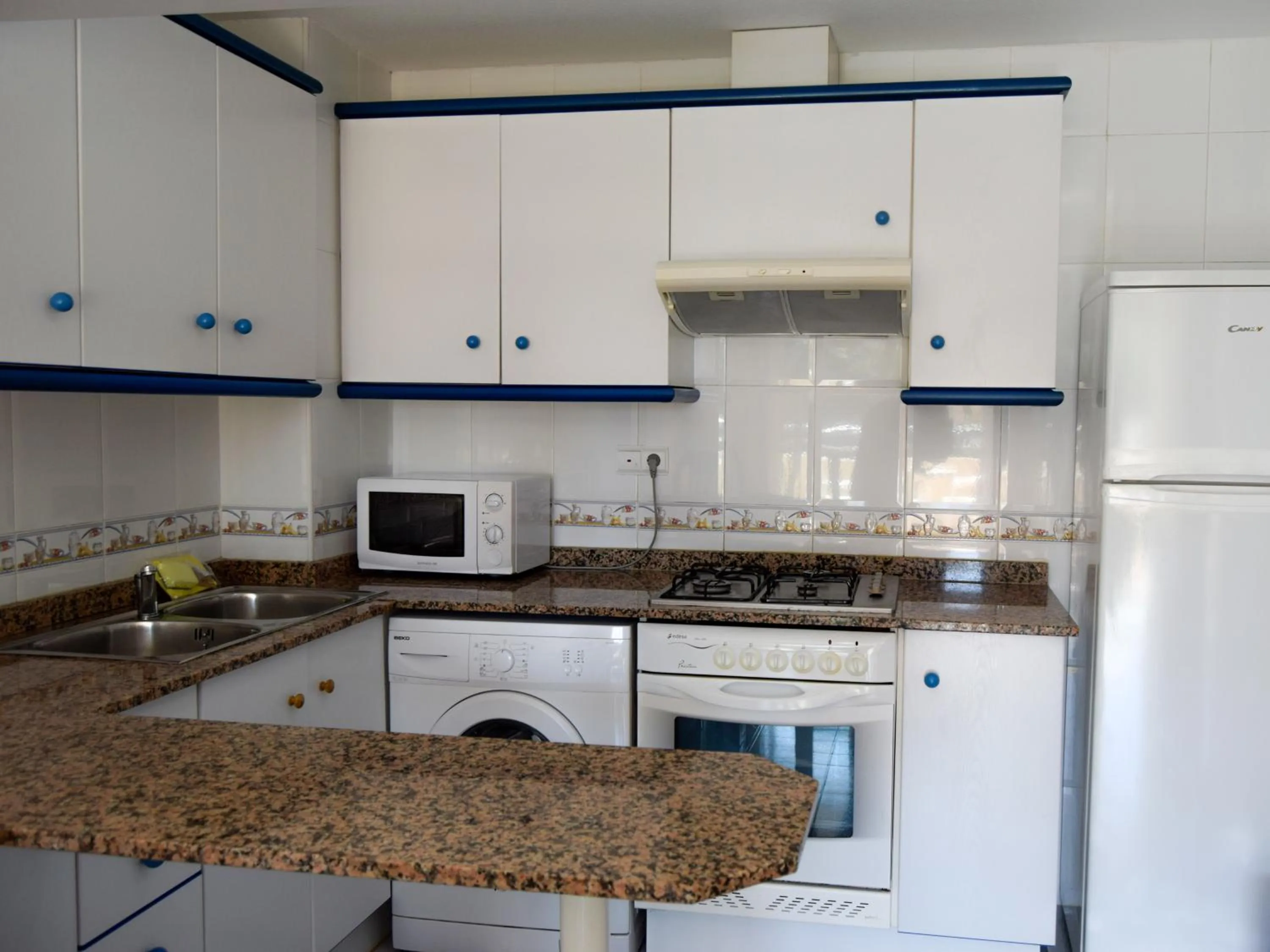 Kitchen or kitchenette in Apartamentos Bonaire 3000