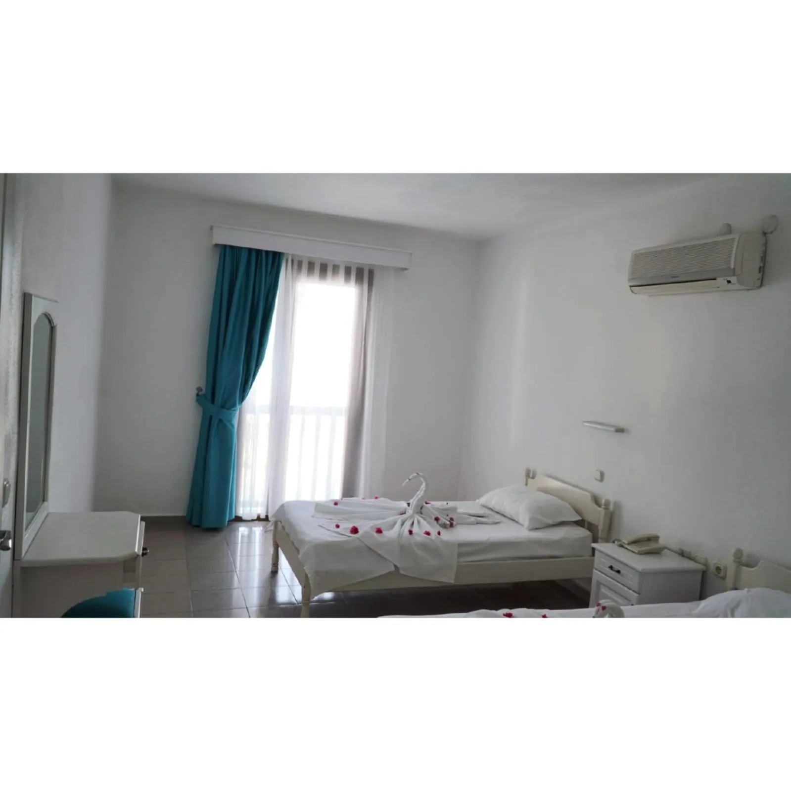 Bed in Gumbet Cove Hotel