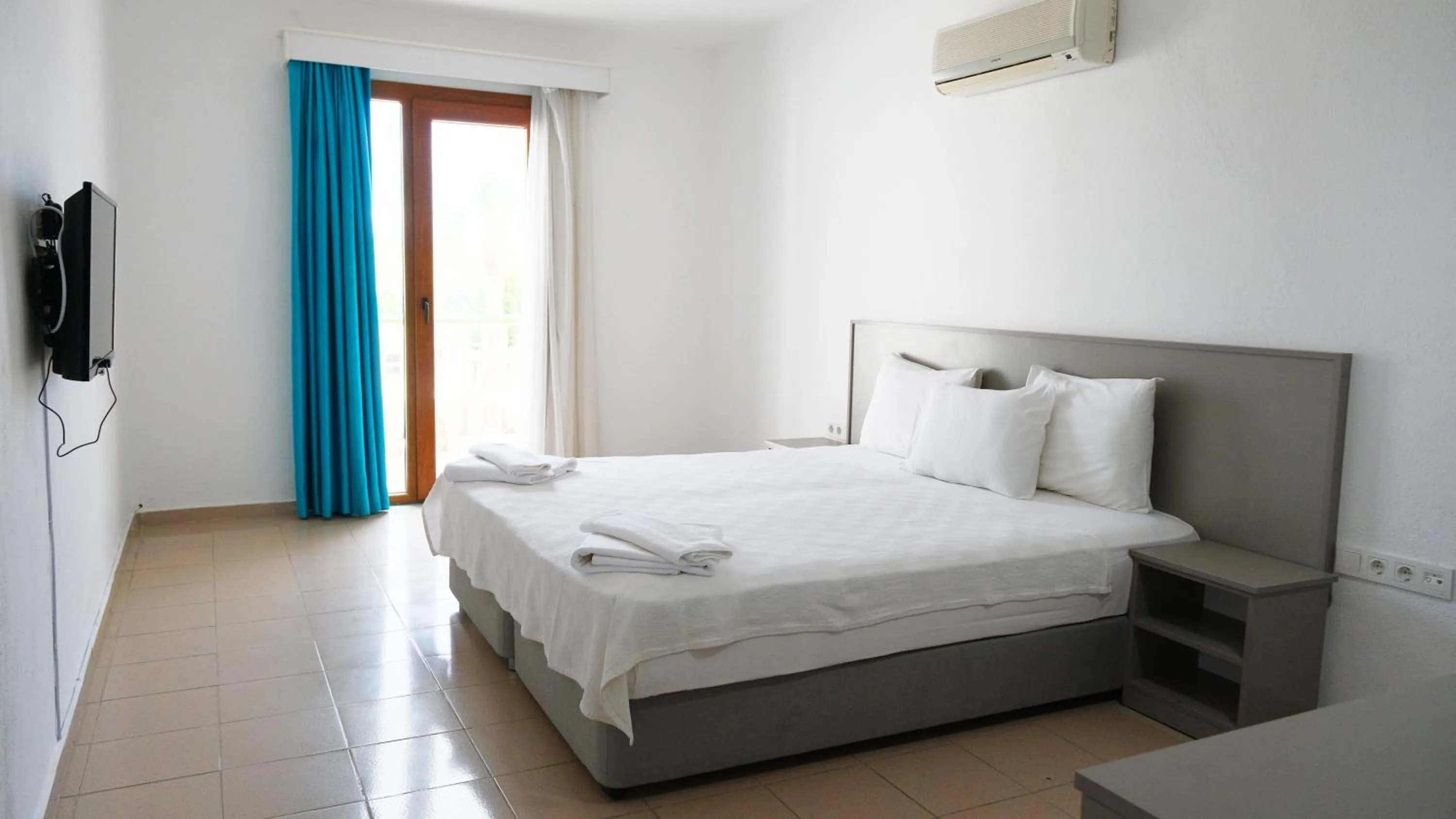 Bed in Gumbet Cove Hotel