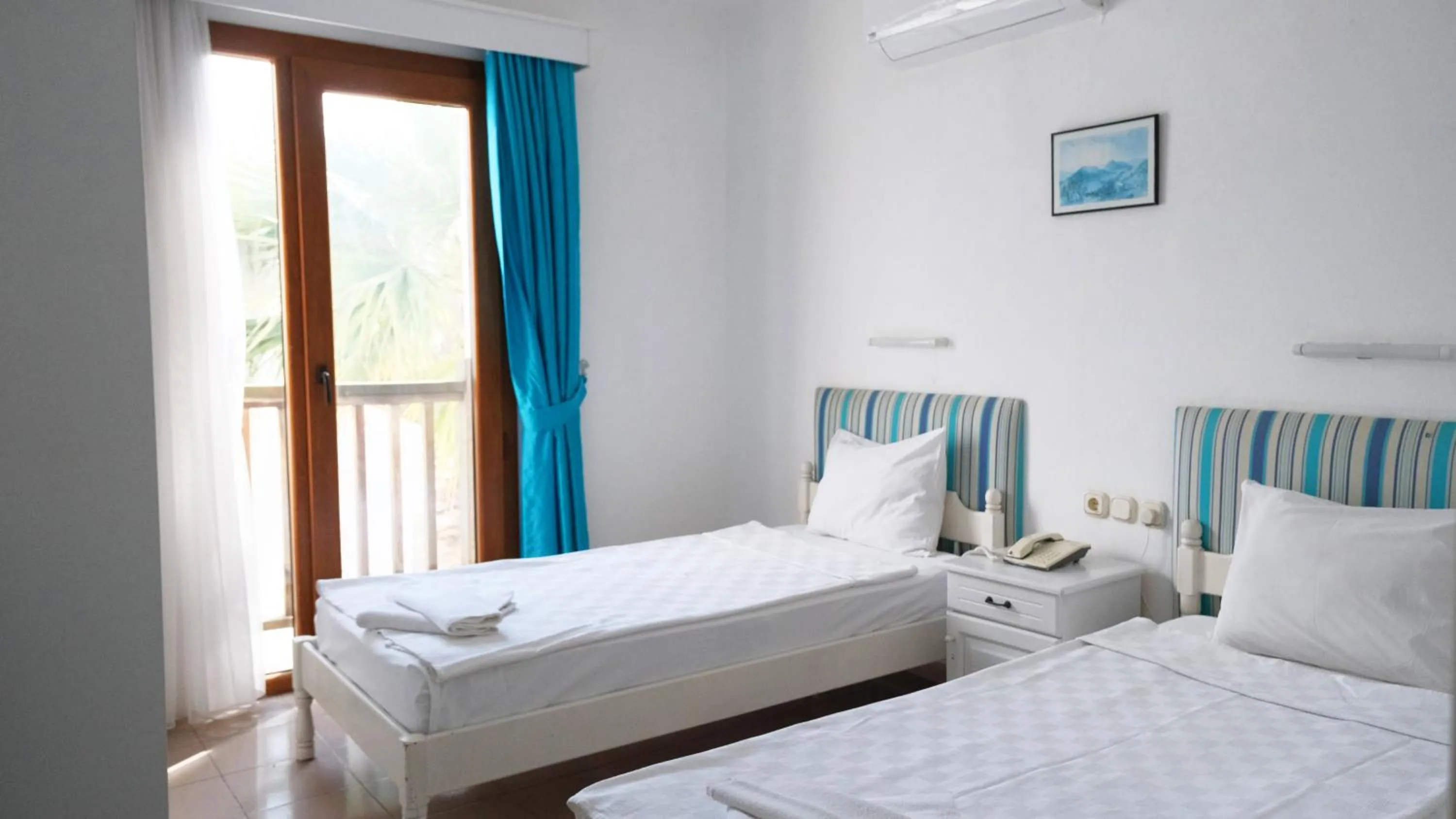 Bed in Gumbet Cove Hotel