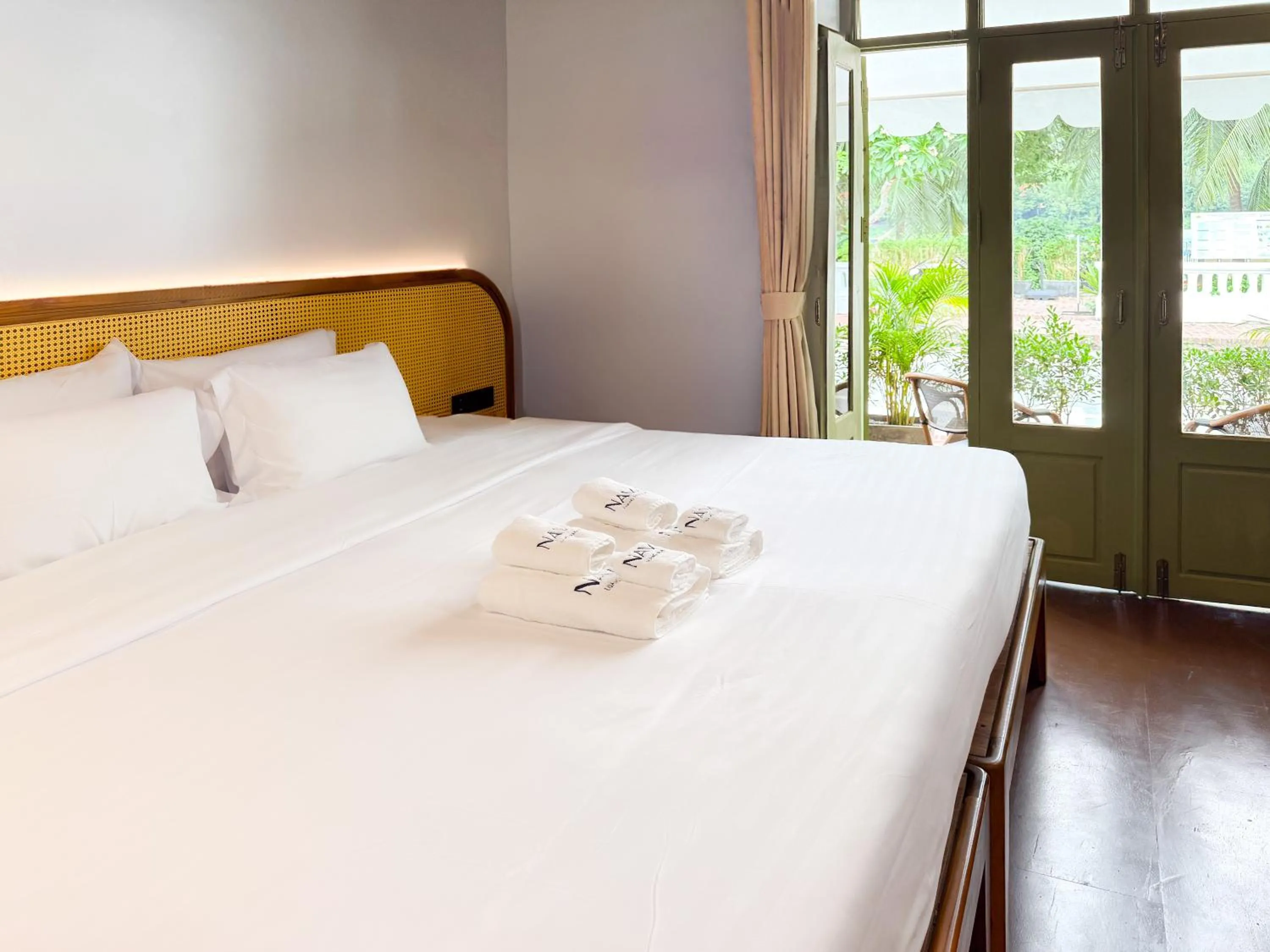 Bed in Nava Luang Prabang Hotel