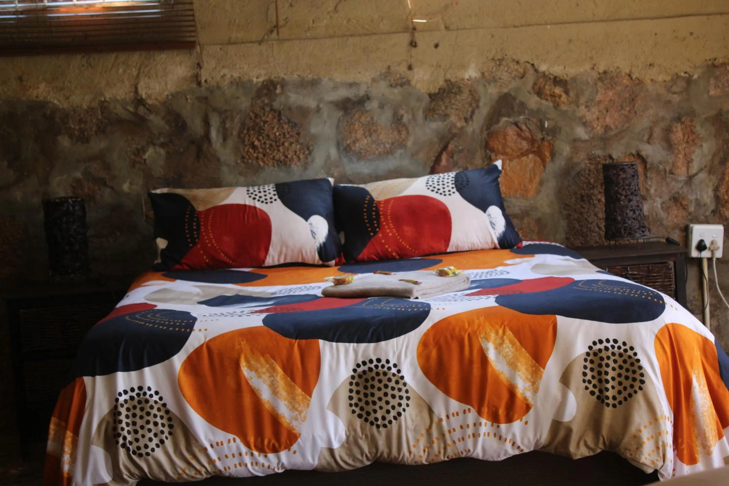 Bed in Emahlathini Guest Farm