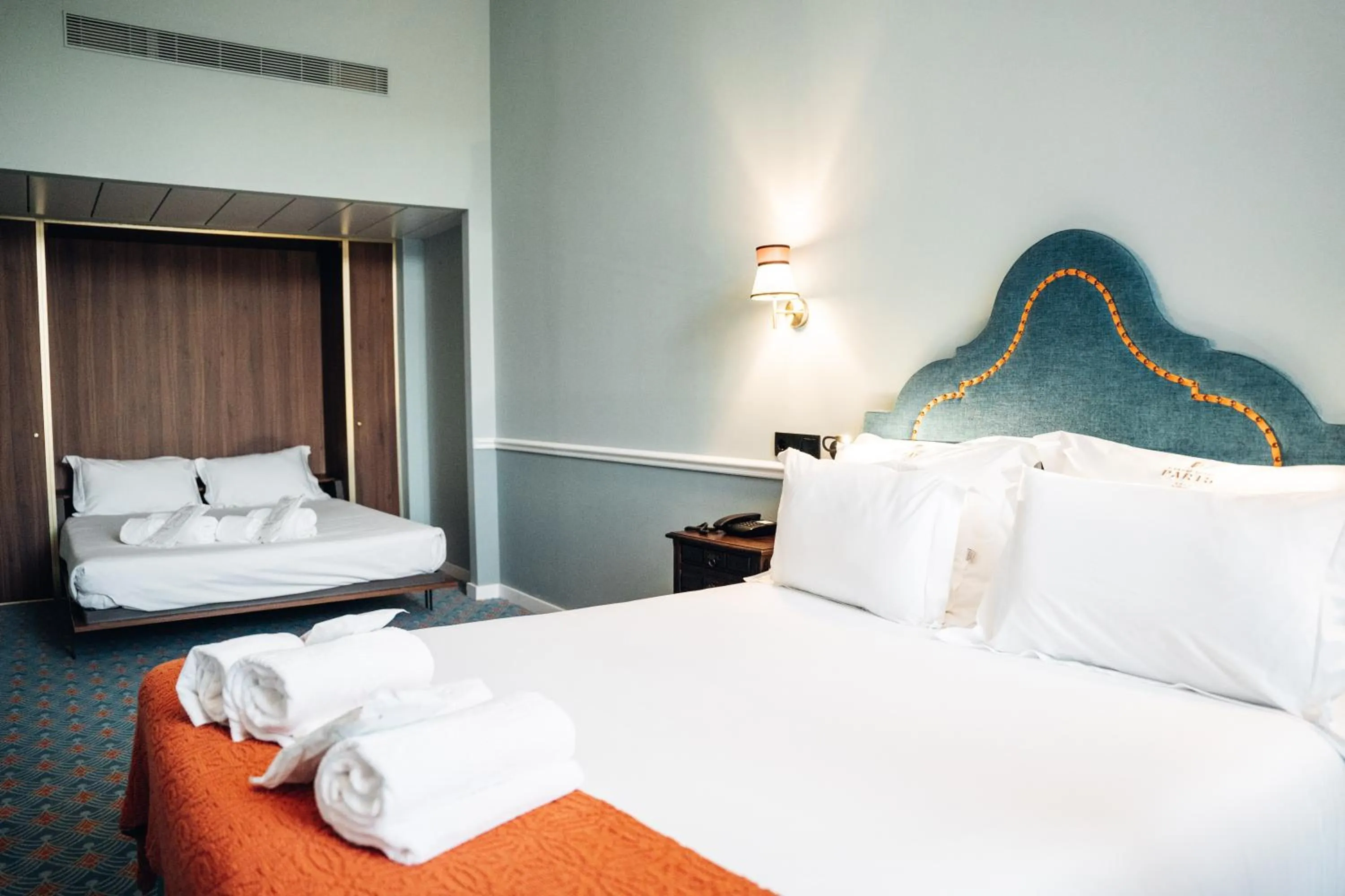 Bed in GRANDE HOTEL PARIS by STAY HOTELS