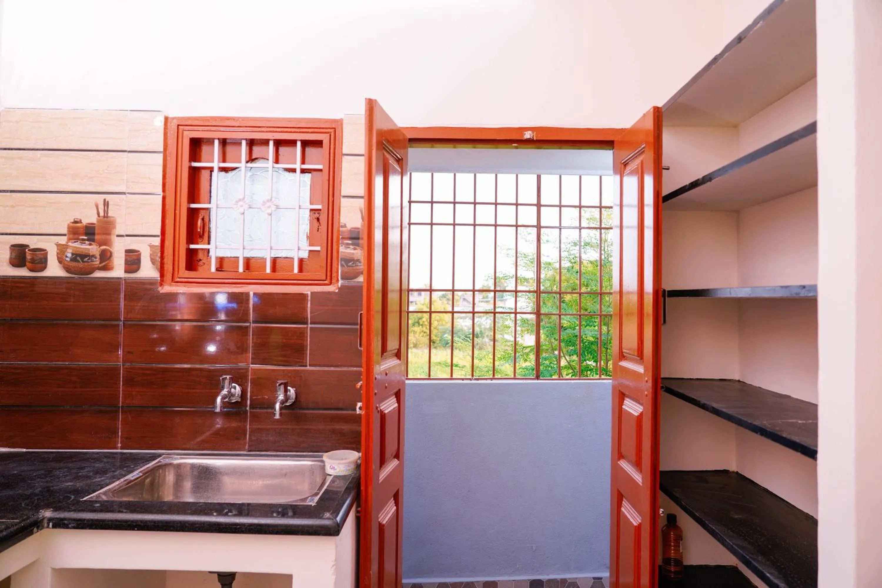 Kitchen or kitchenette in Sri Sakthi Residence