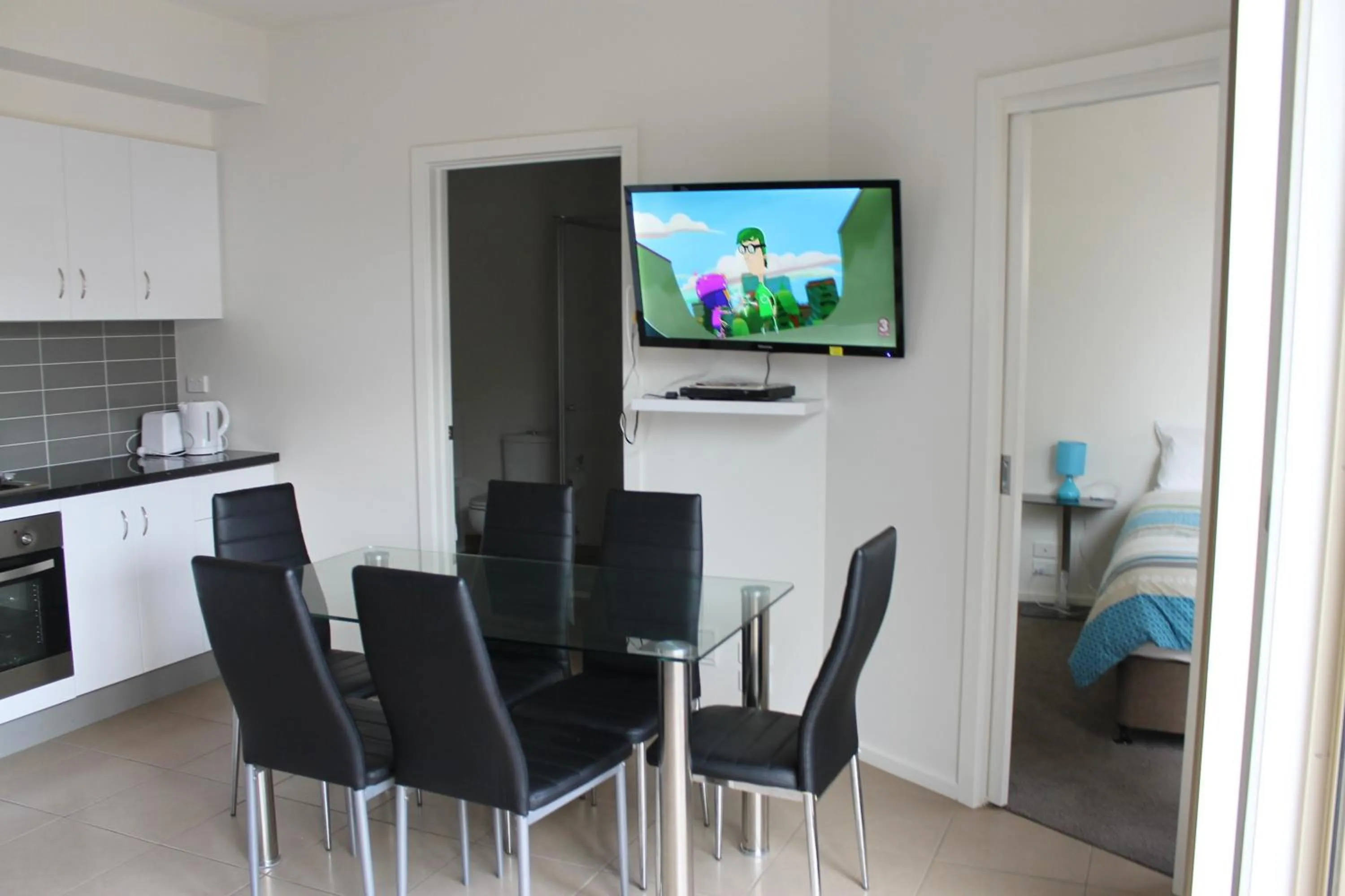 Dining area in McKillop Geelong by Gold Star Stays