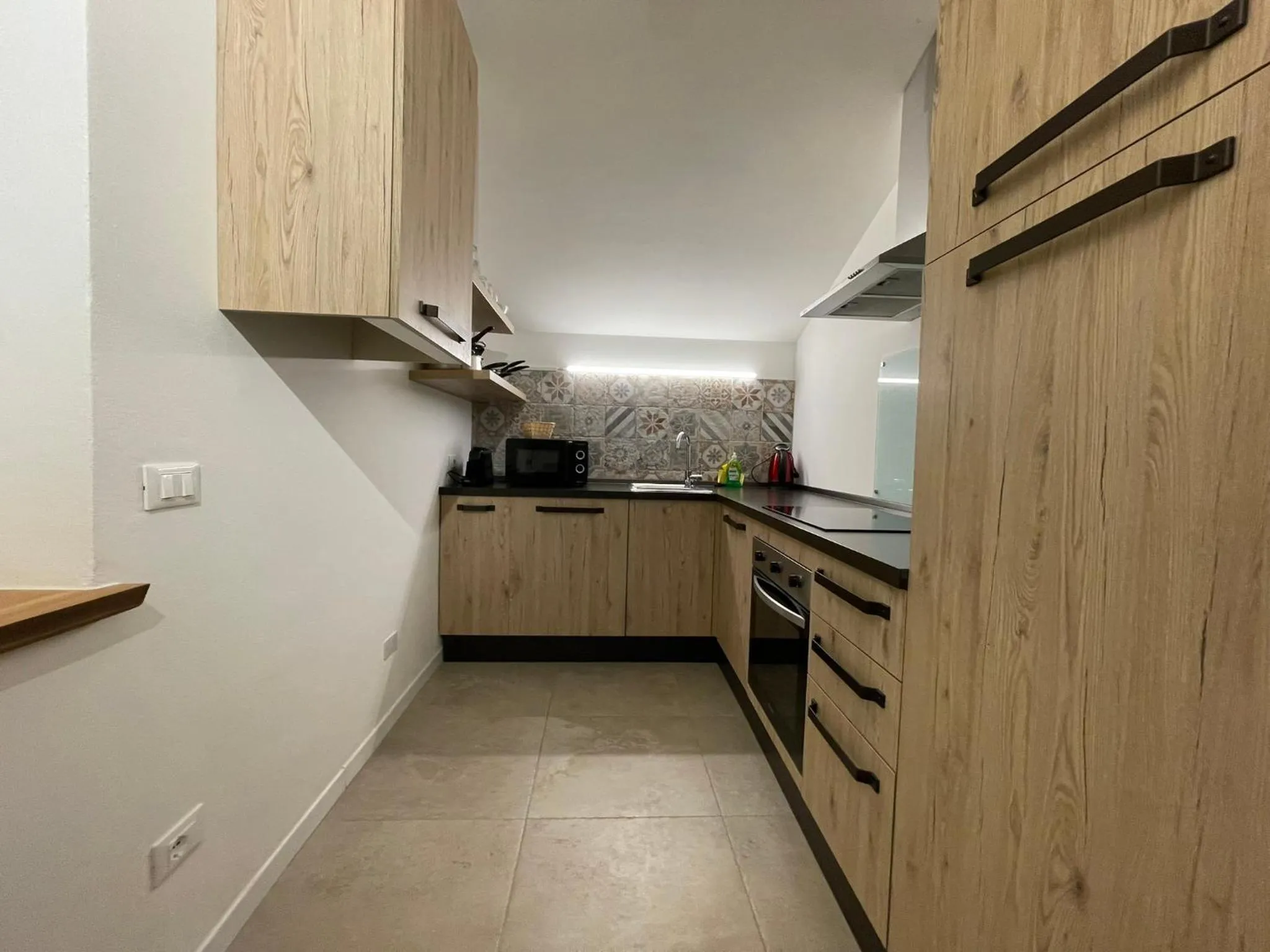 Kitchen or kitchenette in SnowLake Suite & Apartment