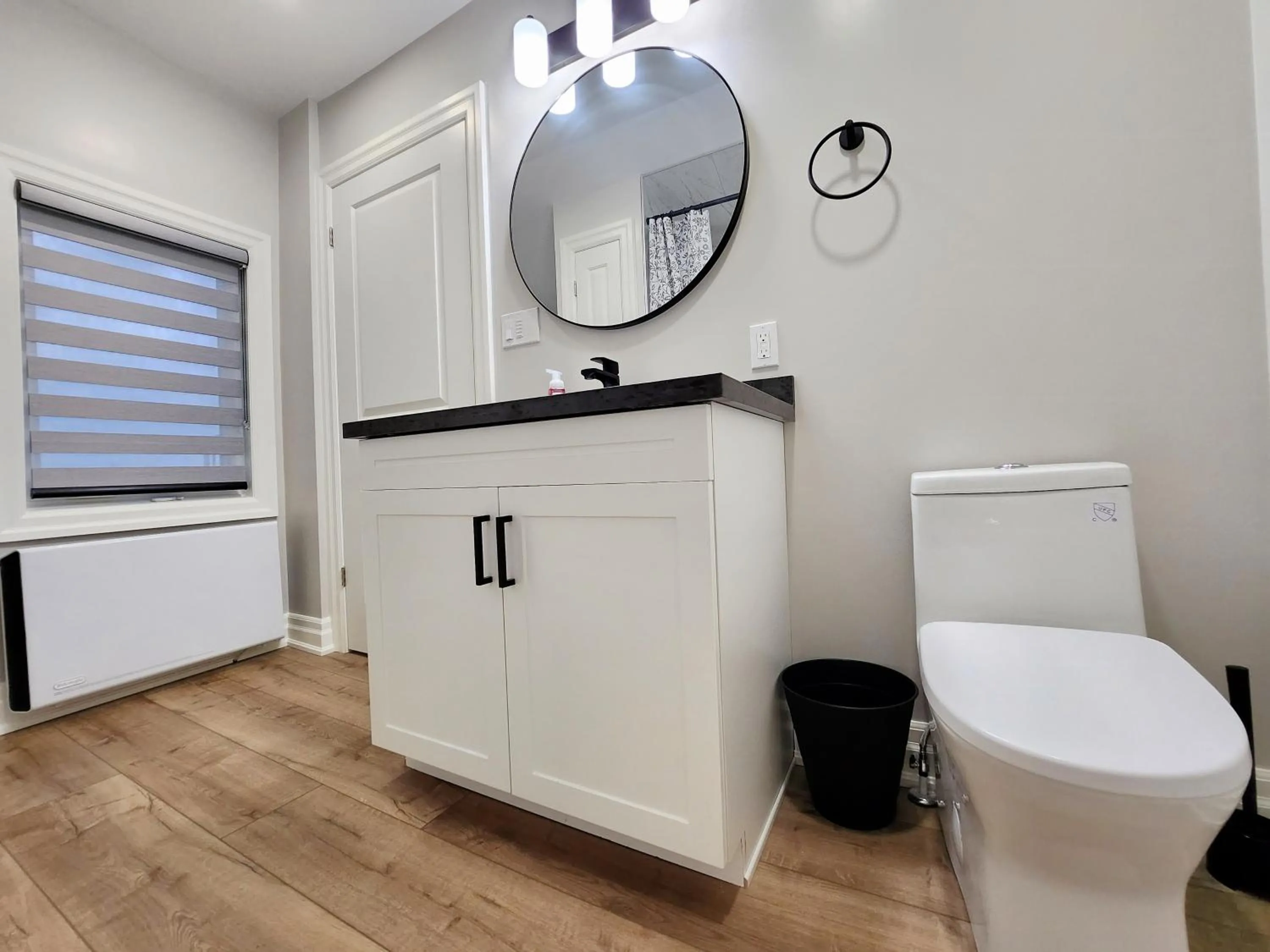 Toilet in The Cozy Cove Modern King-Bedroom Full Apartment