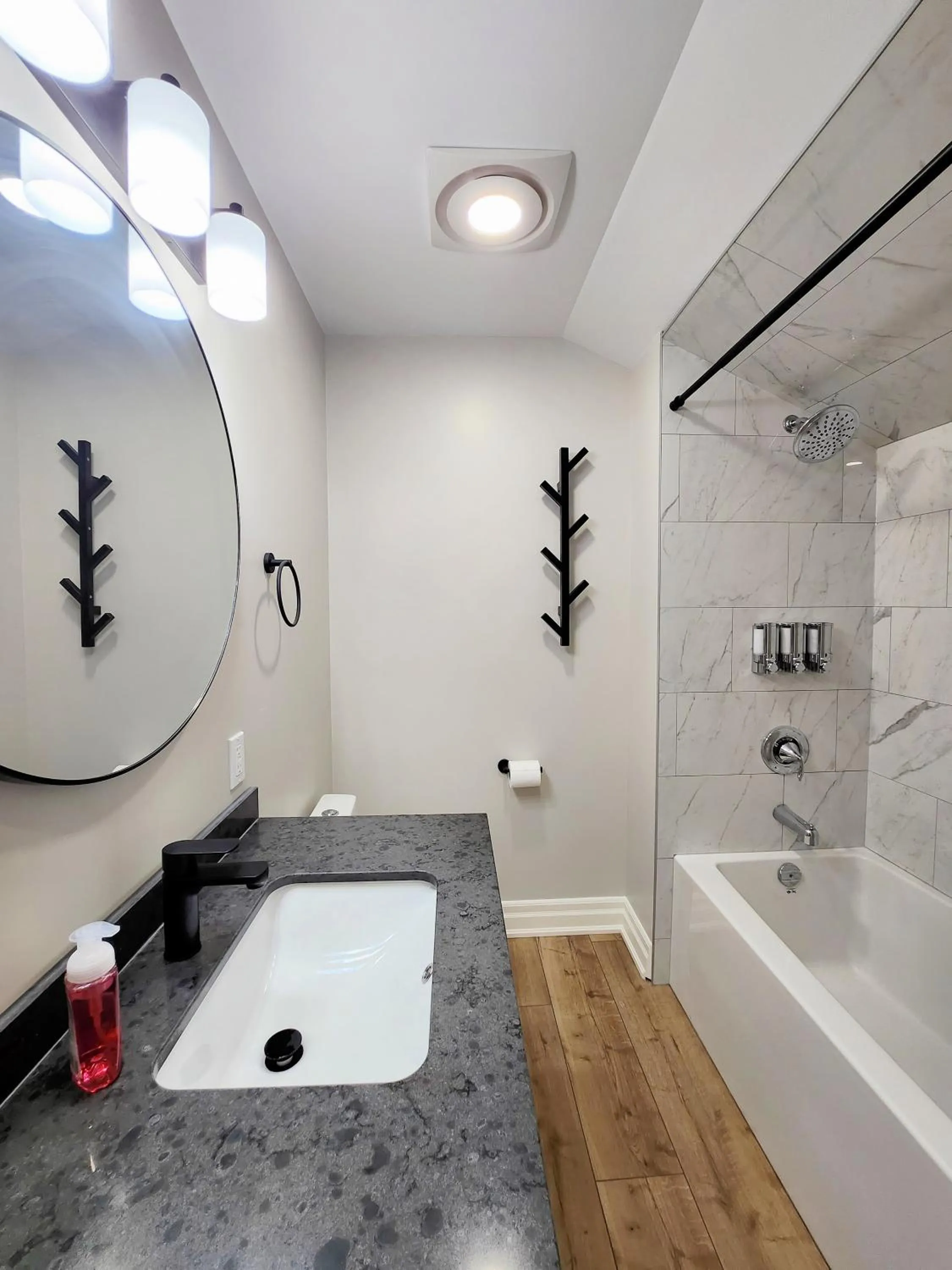 Shower in The Cozy Cove Modern King-Bedroom Full Apartment