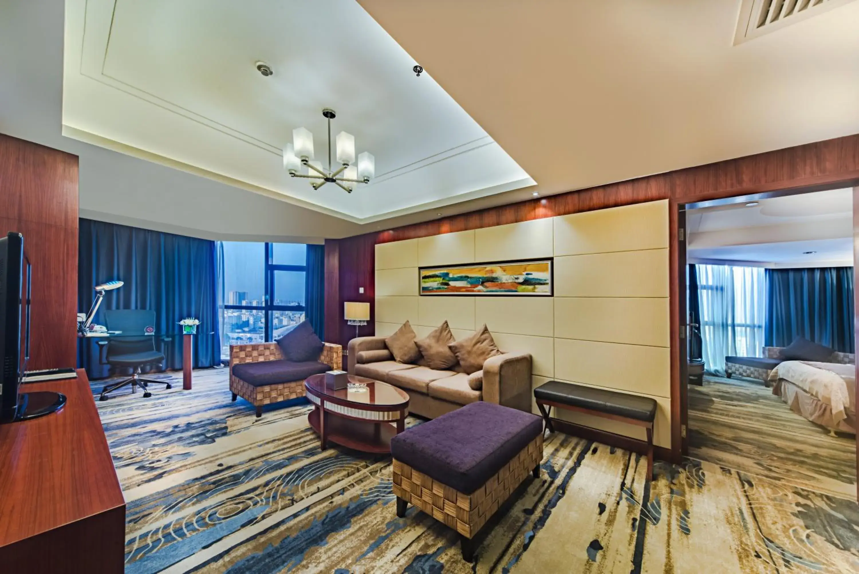 Seating area, Bed in Haikou Mingguang Shengyi Hotel (Previous Mingguang International Hotel) Seating area, Bed in Haikou Mingguang Shengyi Hotel (Previous Mingguang International Hotel)