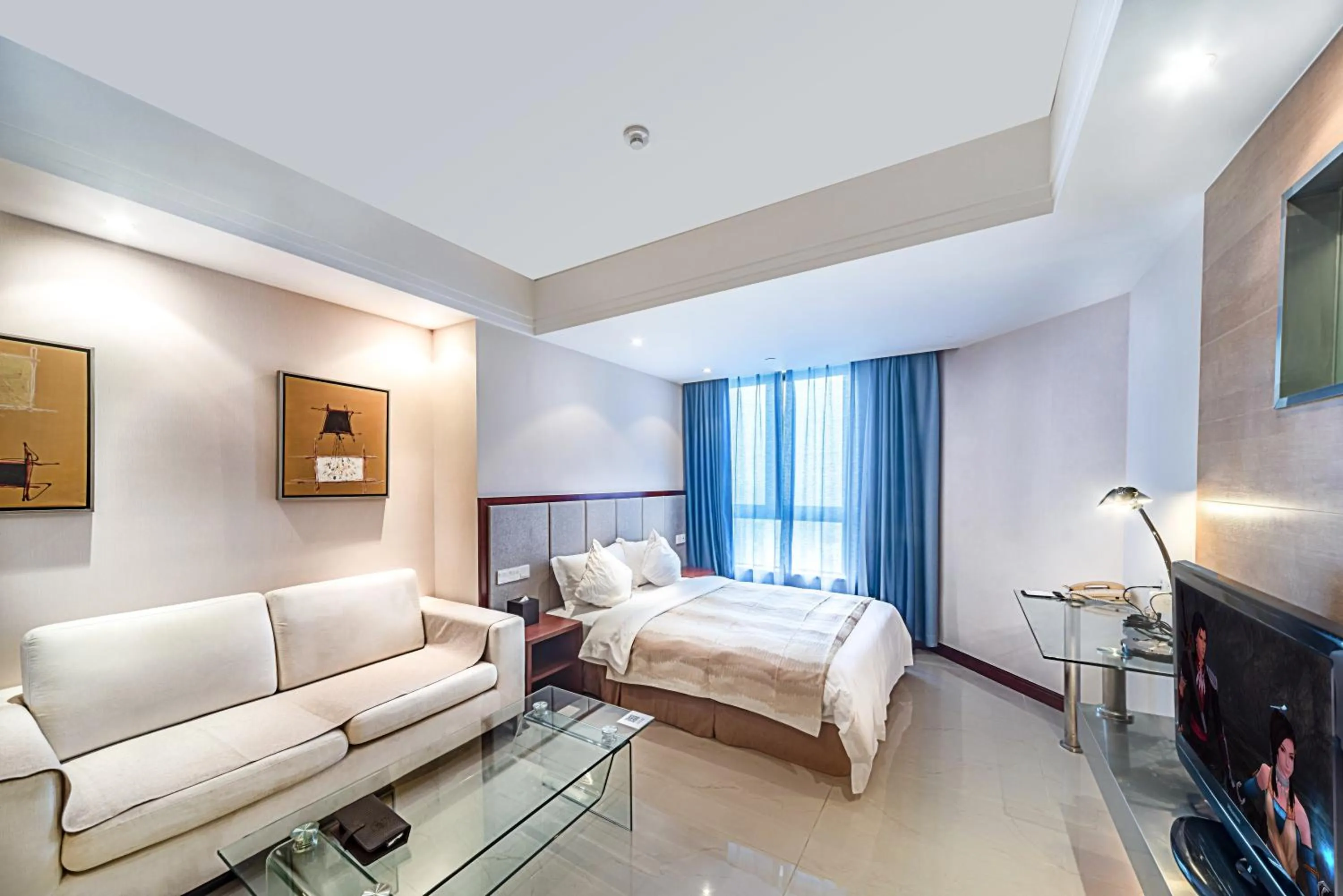 Photo of the whole room, Bed in Haikou Mingguang Shengyi Hotel