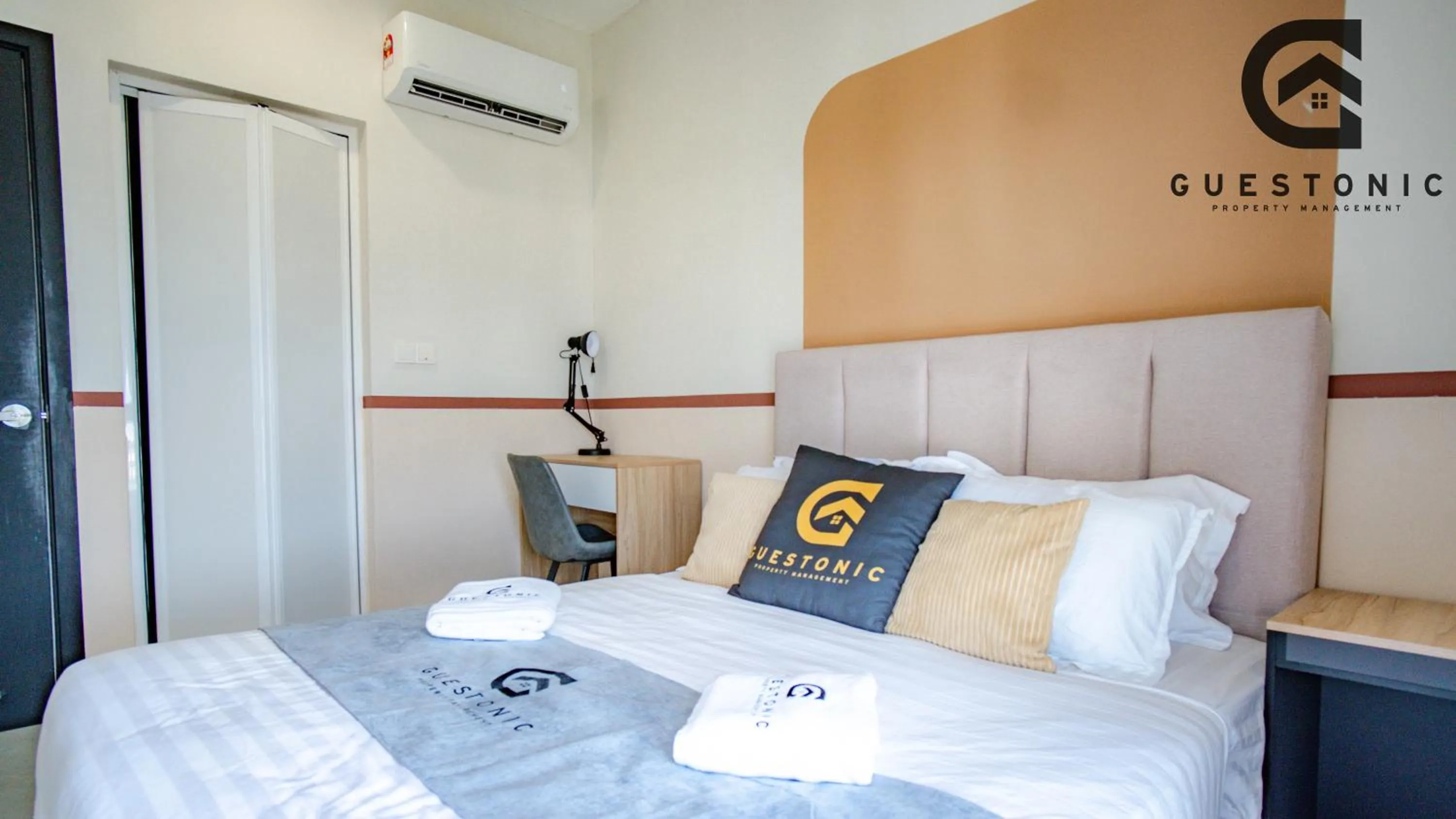 Bed in NeuSuite Cozy Studio by GUESTONIC