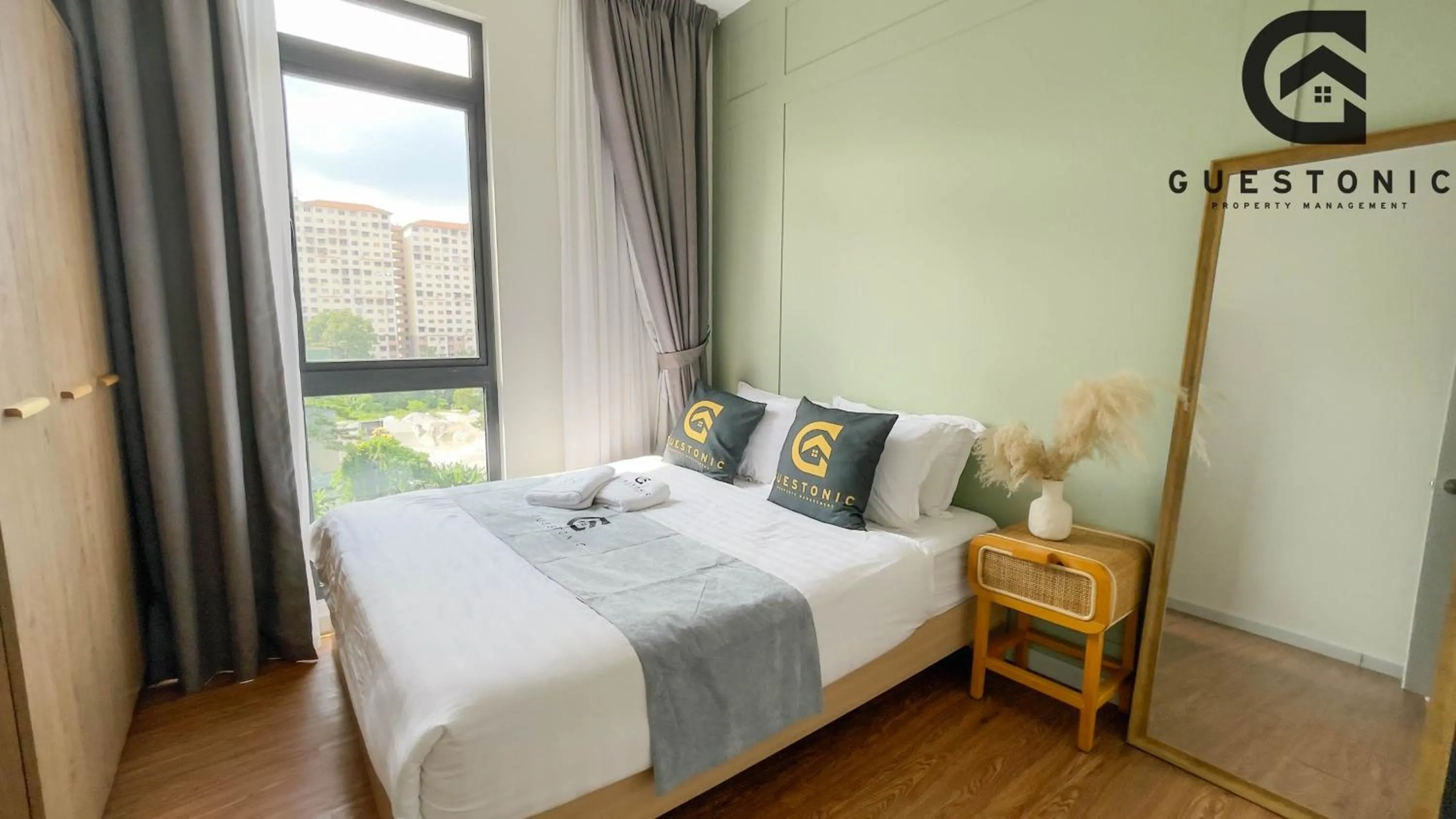 Bed in NeuSuite Cozy Studio by GUESTONIC