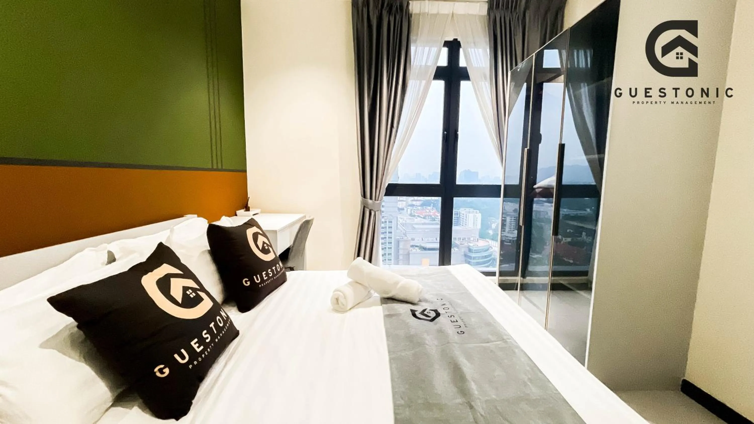 Bed in NeuSuite Cozy Studio by GUESTONIC