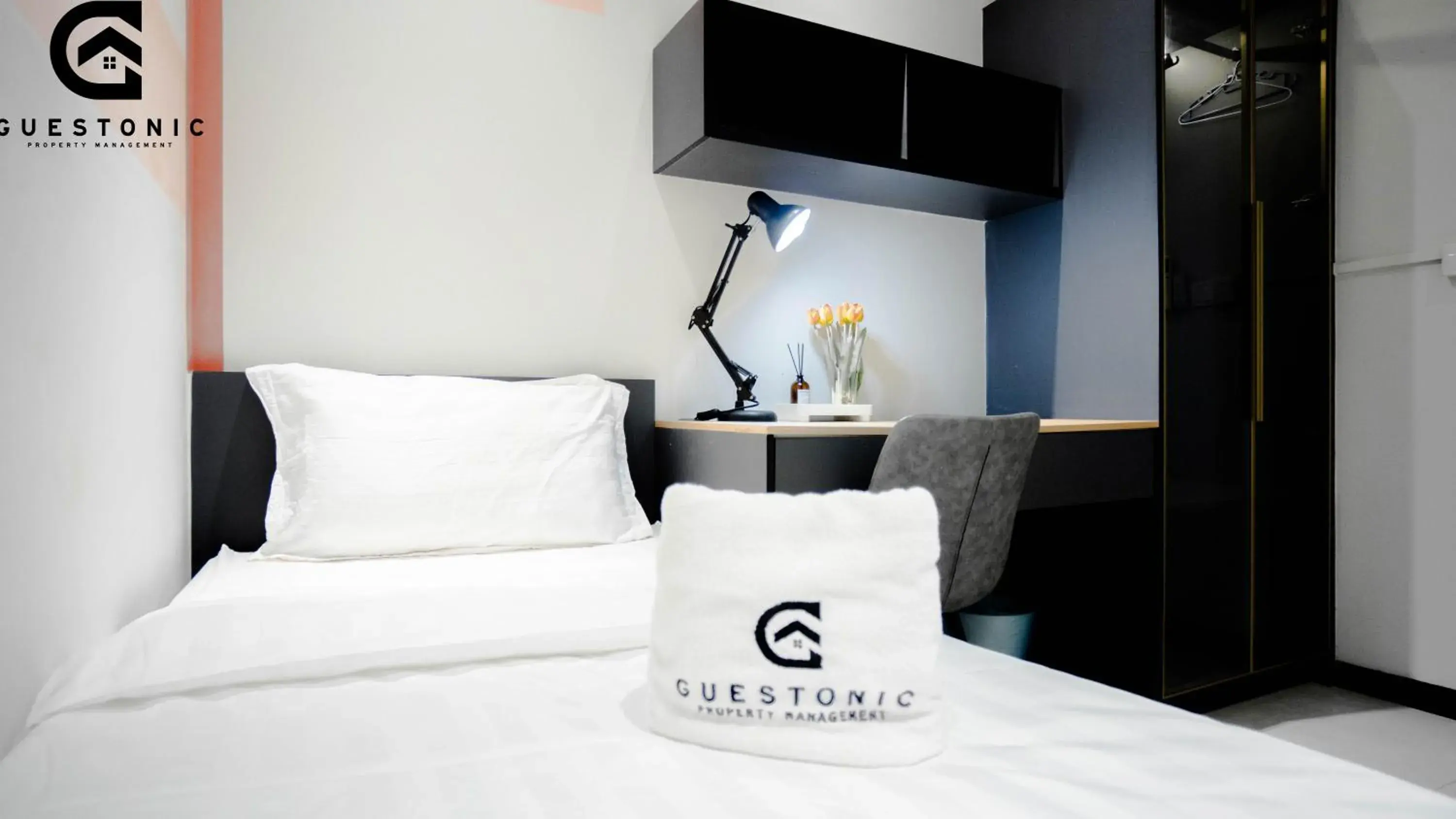 Bed in NeuSuite Cozy Studio by GUESTONIC Bed in NeuSuite Cozy Studio by GUESTONIC