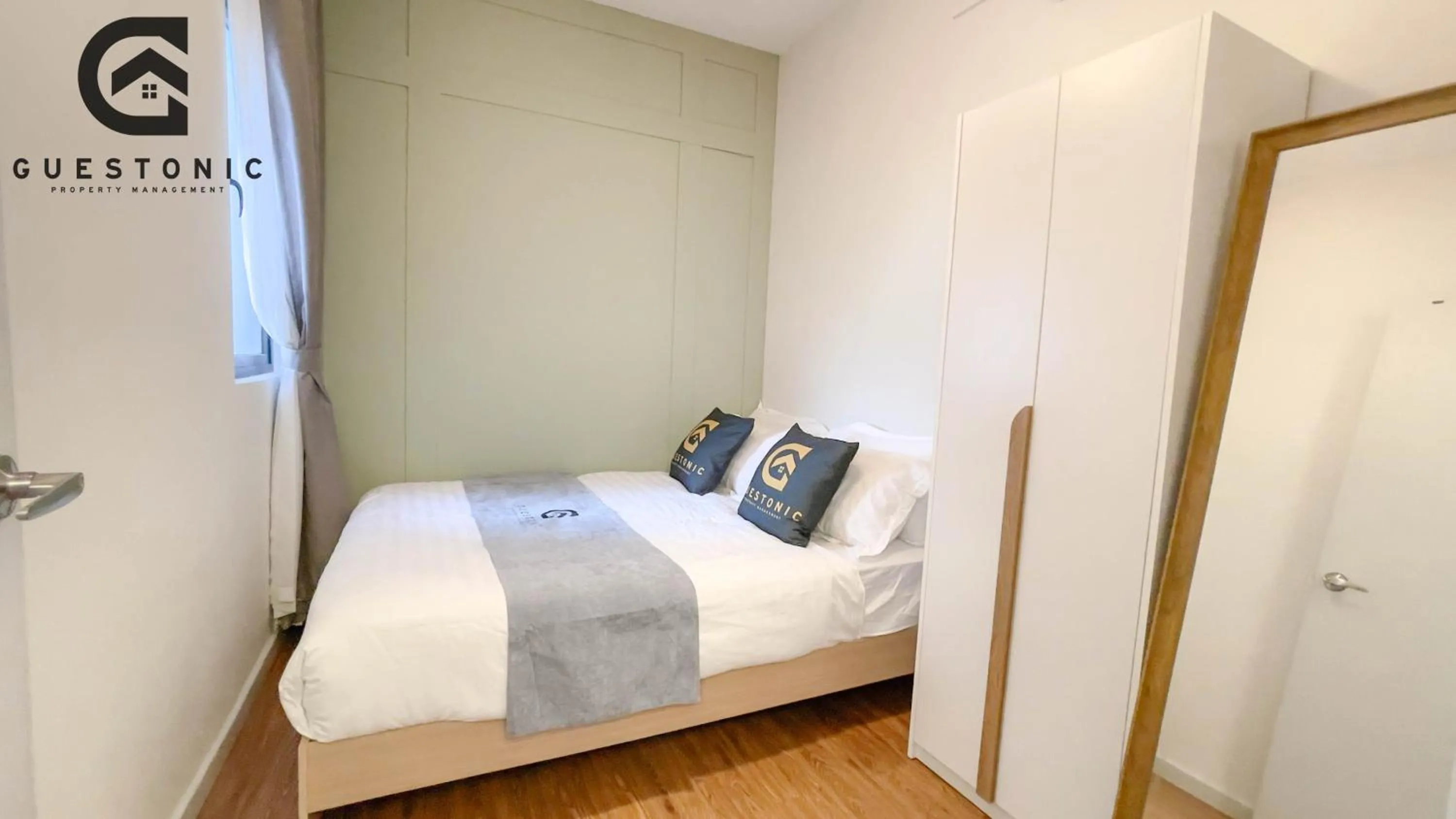 Bed in NeuSuite Cozy Studio by GUESTONIC