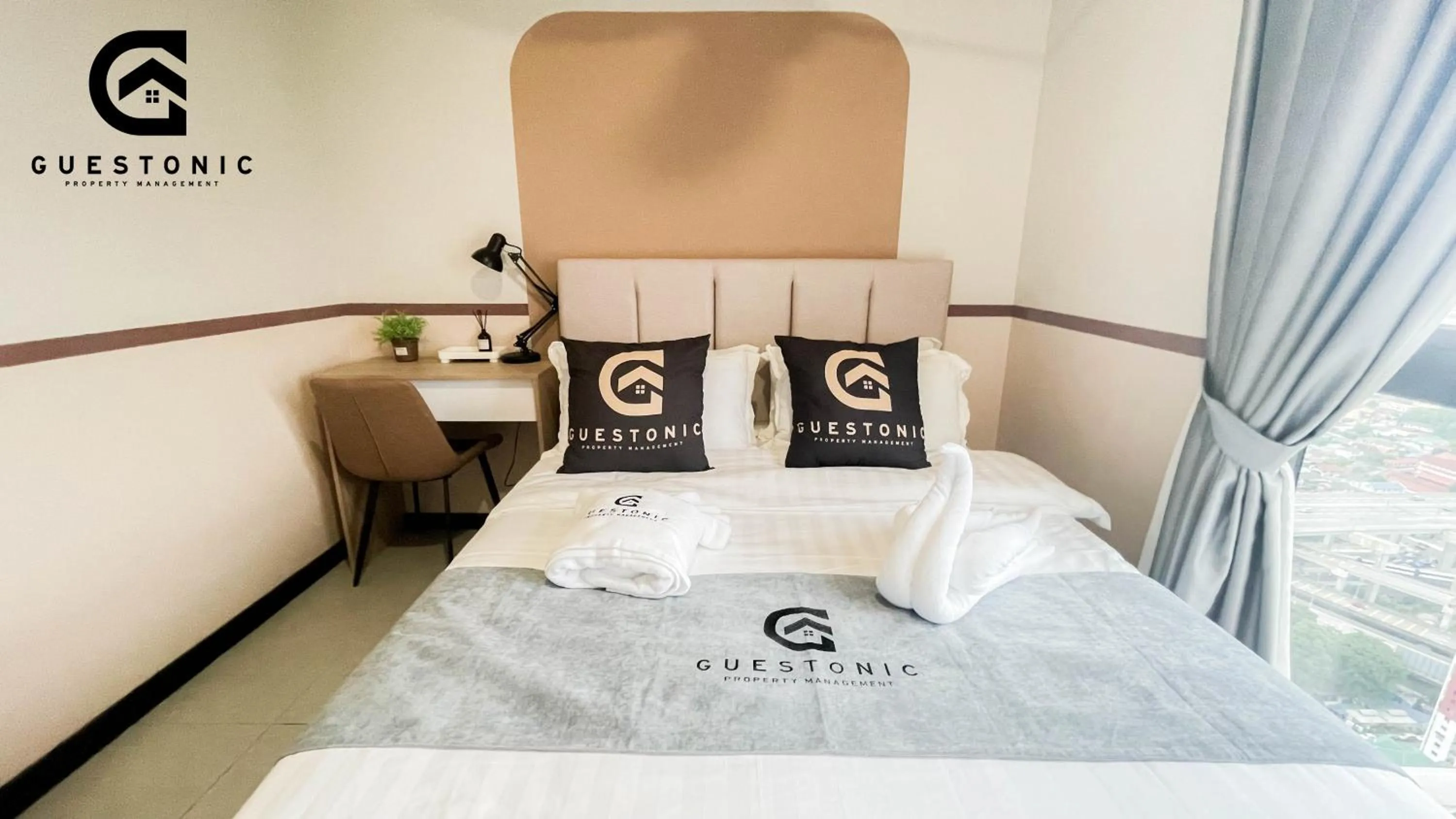 Bed in NeuSuite Cozy Studio by GUESTONIC