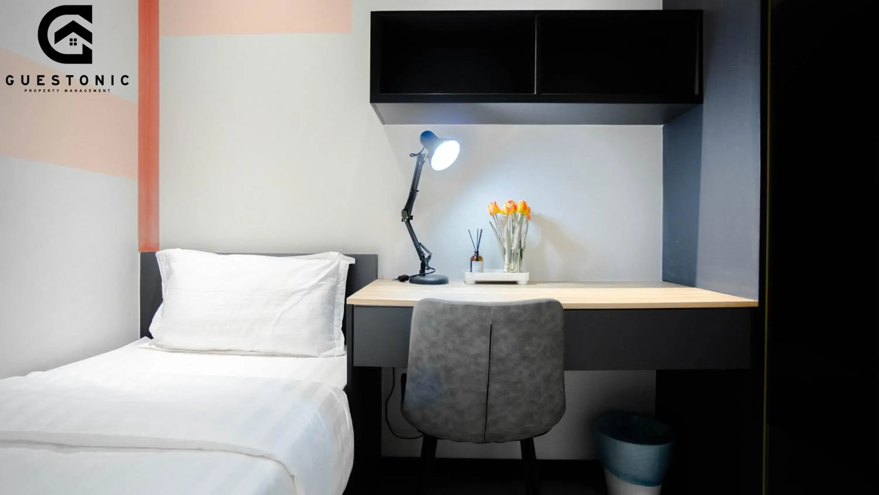 Bed in NeuSuite Cozy Studio by GUESTONIC Bed in NeuSuite Cozy Studio by GUESTONIC