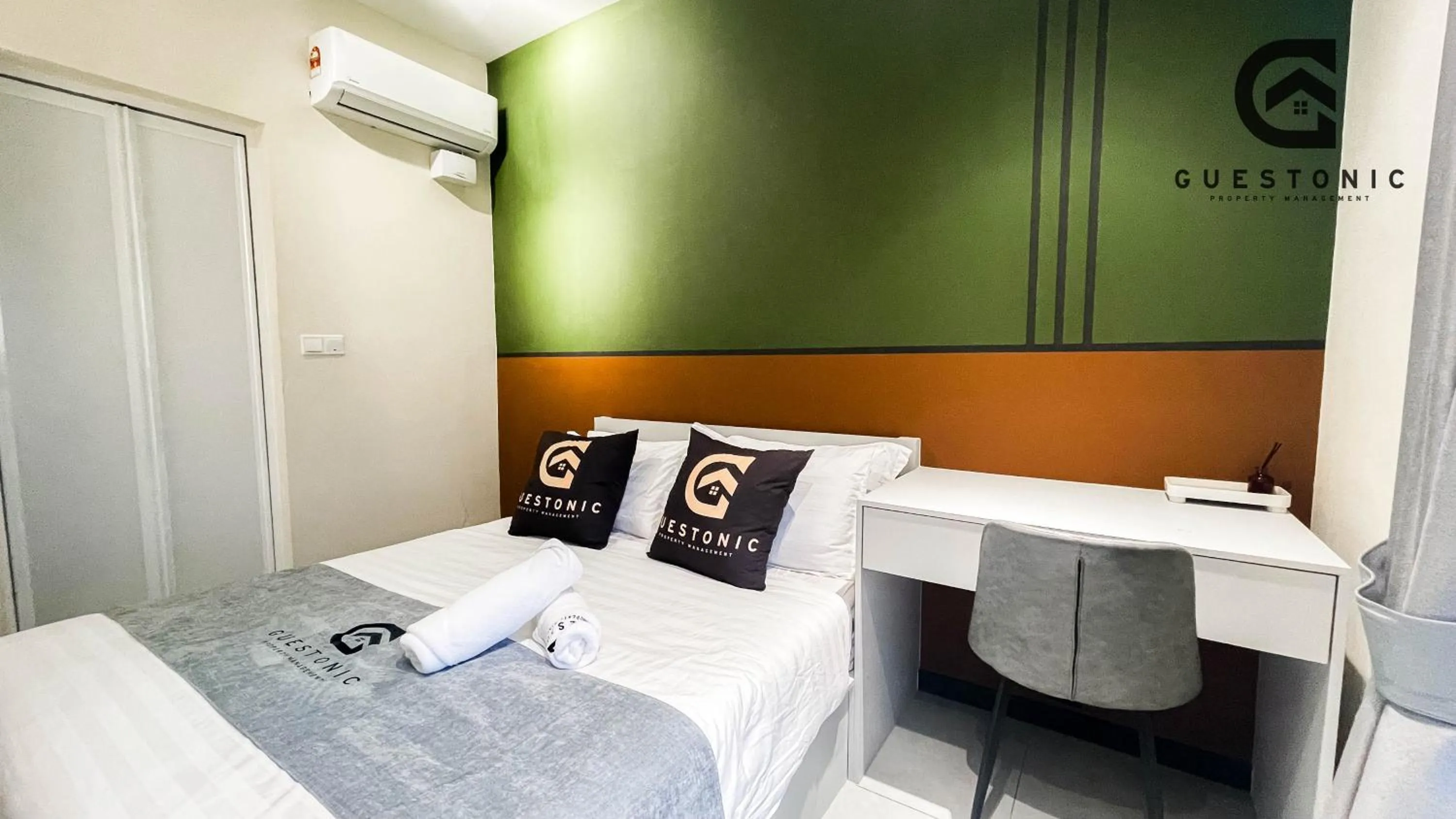 Bed in NeuSuite Cozy Studio by GUESTONIC