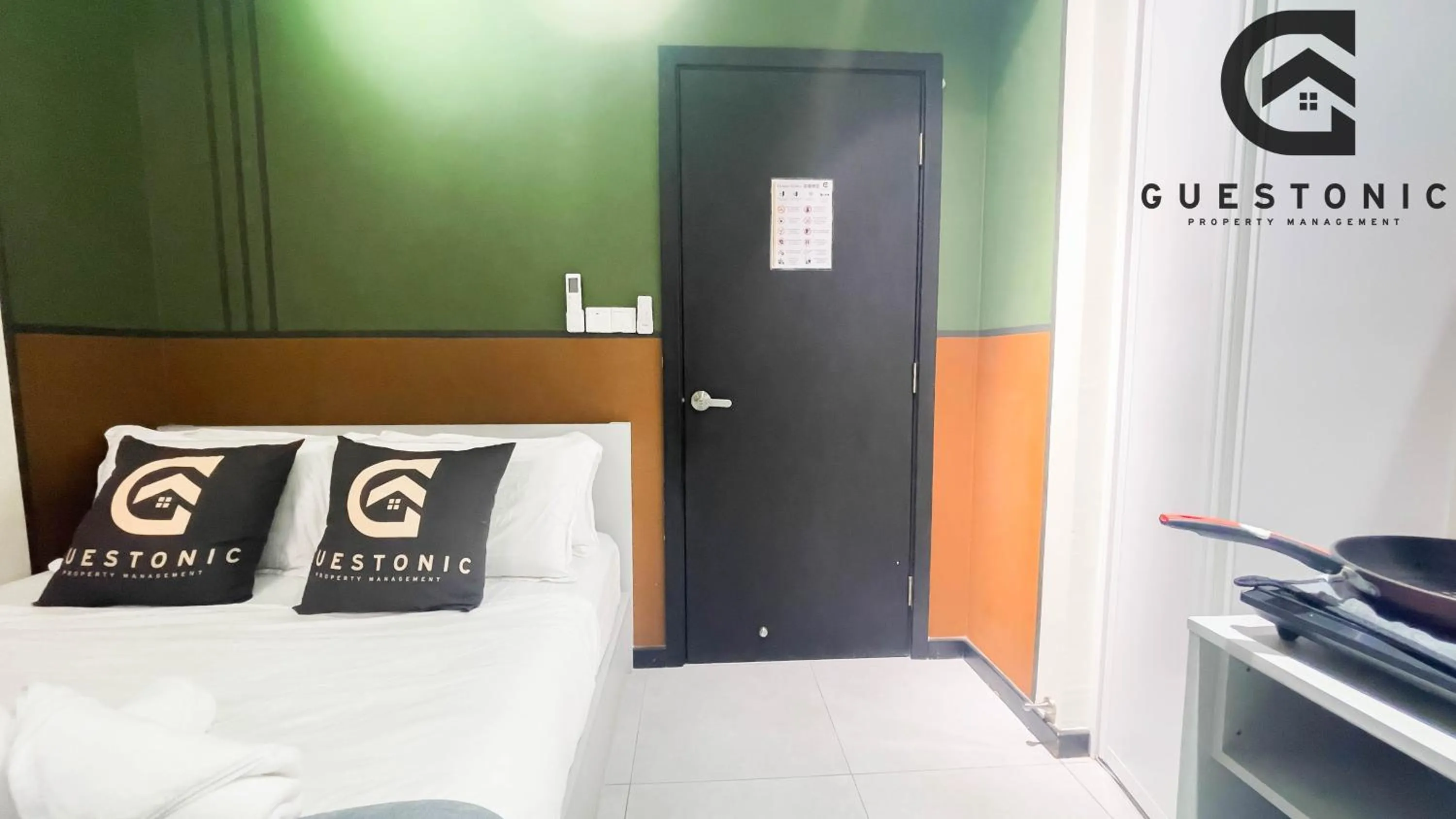 Bed in NeuSuite Cozy Studio by GUESTONIC