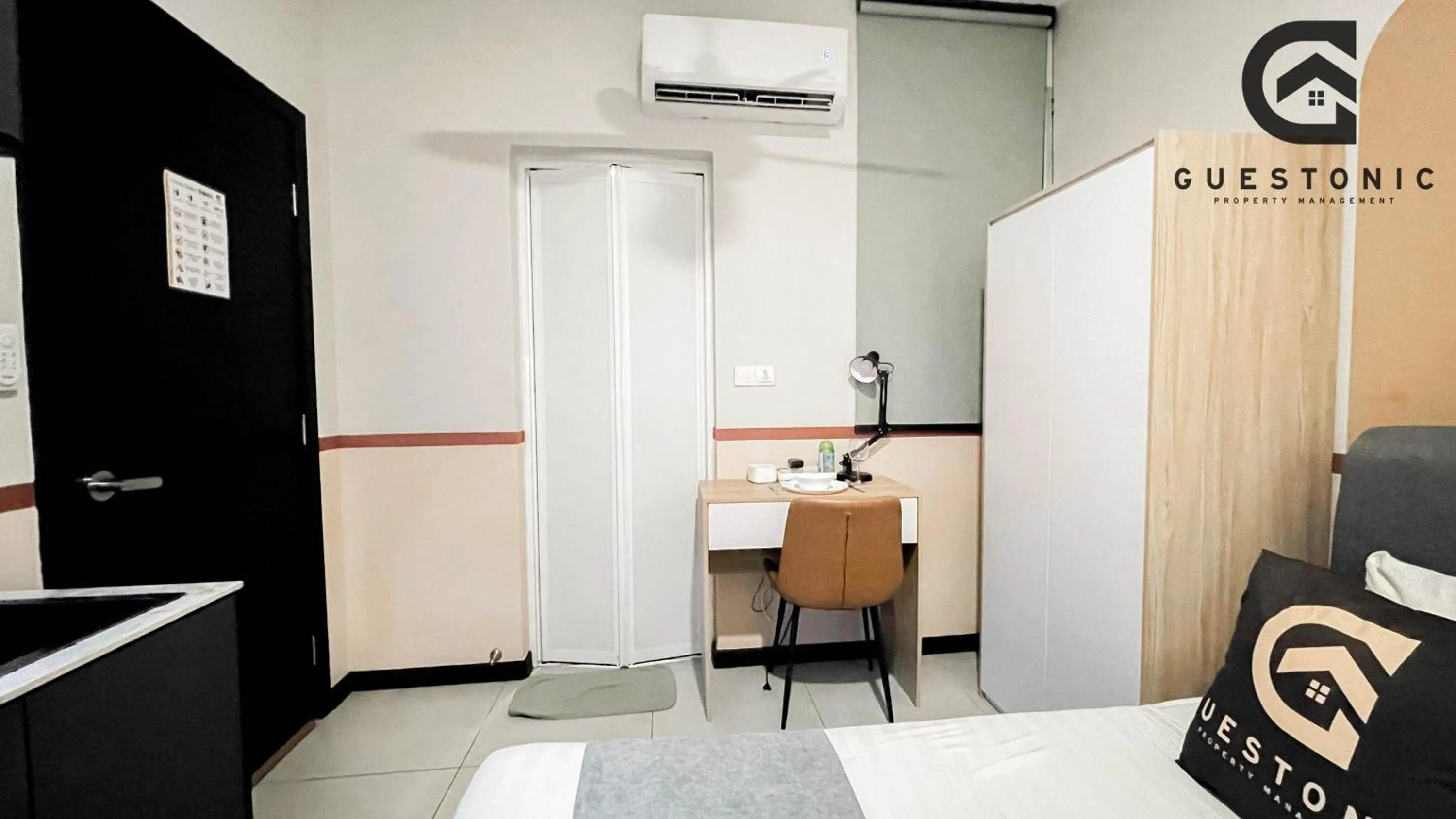 Bed in NeuSuite Cozy Studio by GUESTONIC