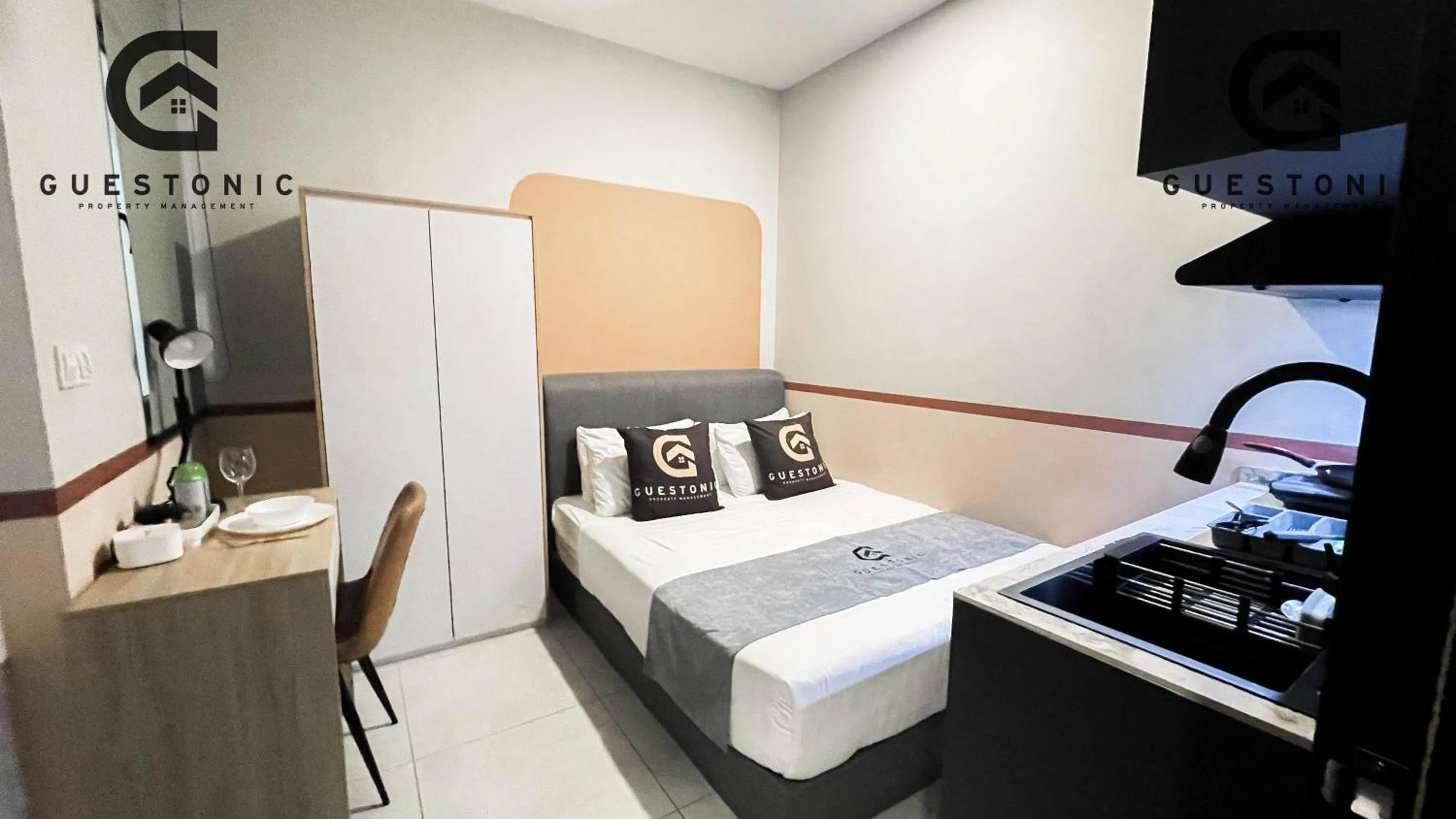 Bed in NeuSuite Cozy Studio by GUESTONIC