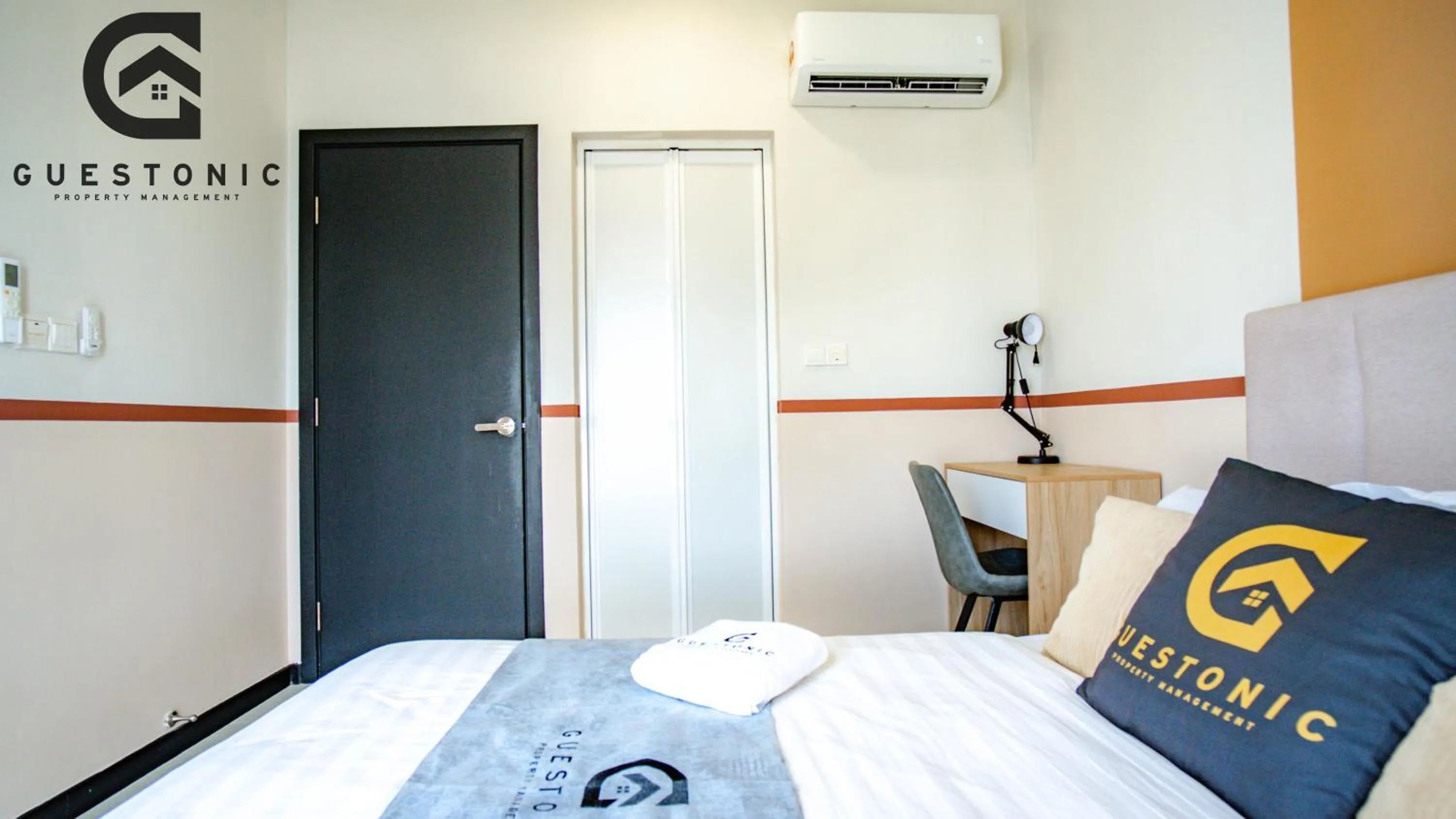 Bed in NeuSuite Cozy Studio by GUESTONIC