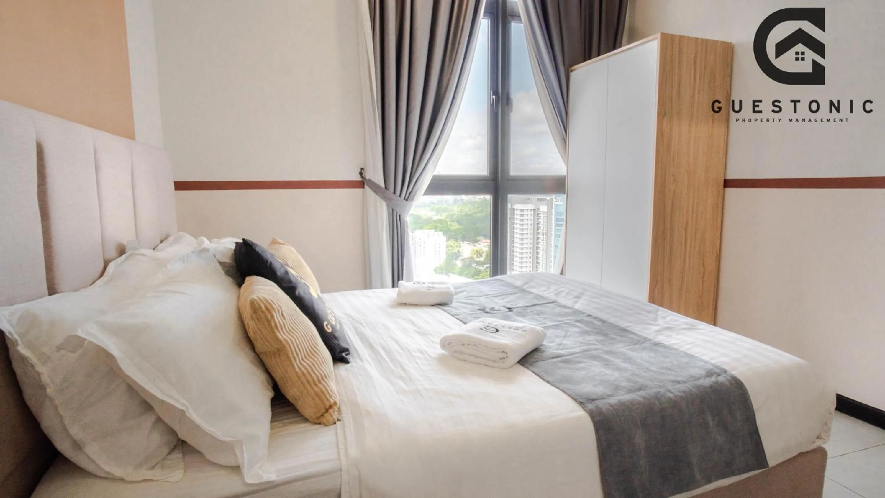 Bed in NeuSuite Cozy Studio by GUESTONIC