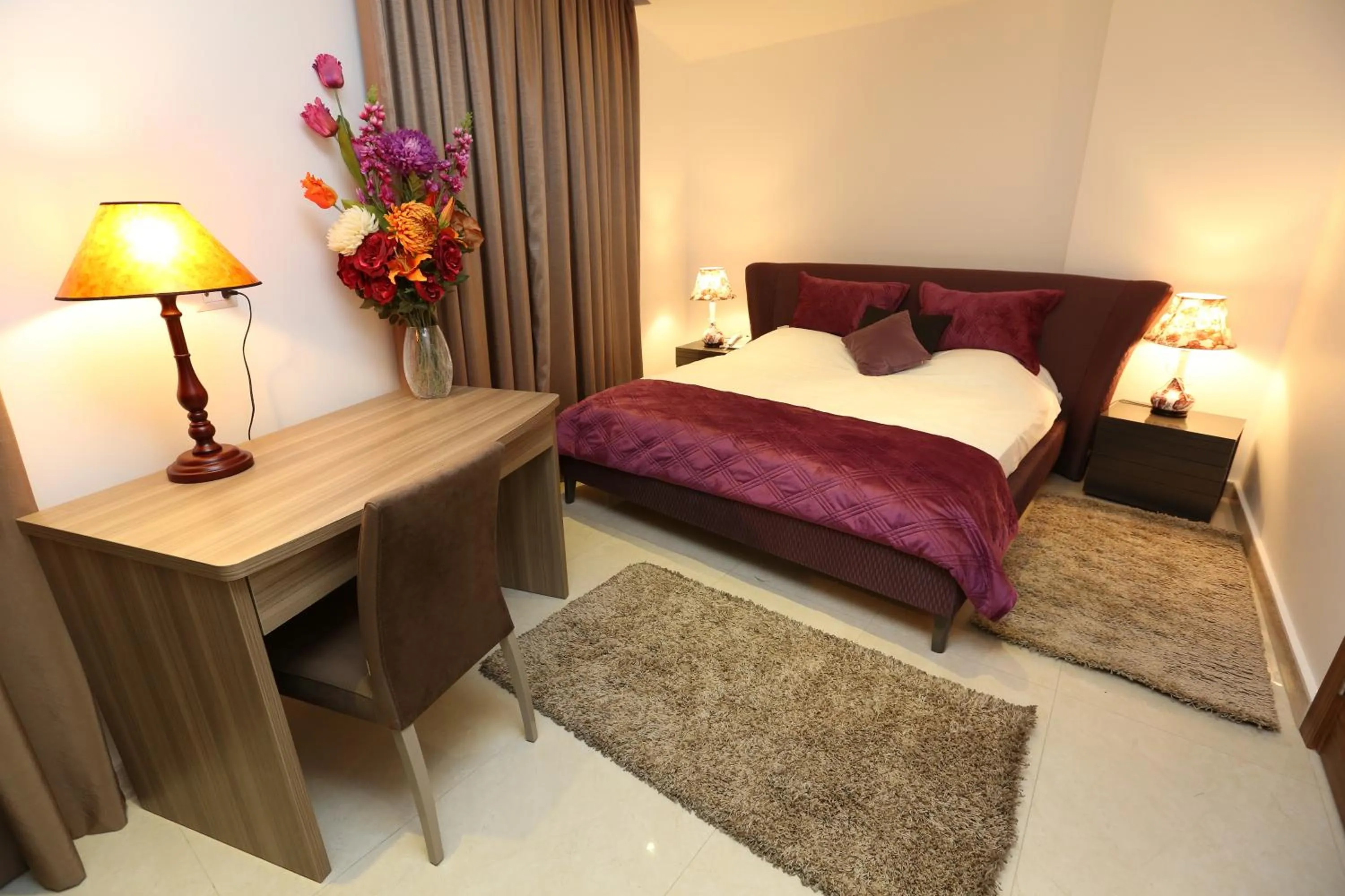 Bed in Delora Hotel and Suites