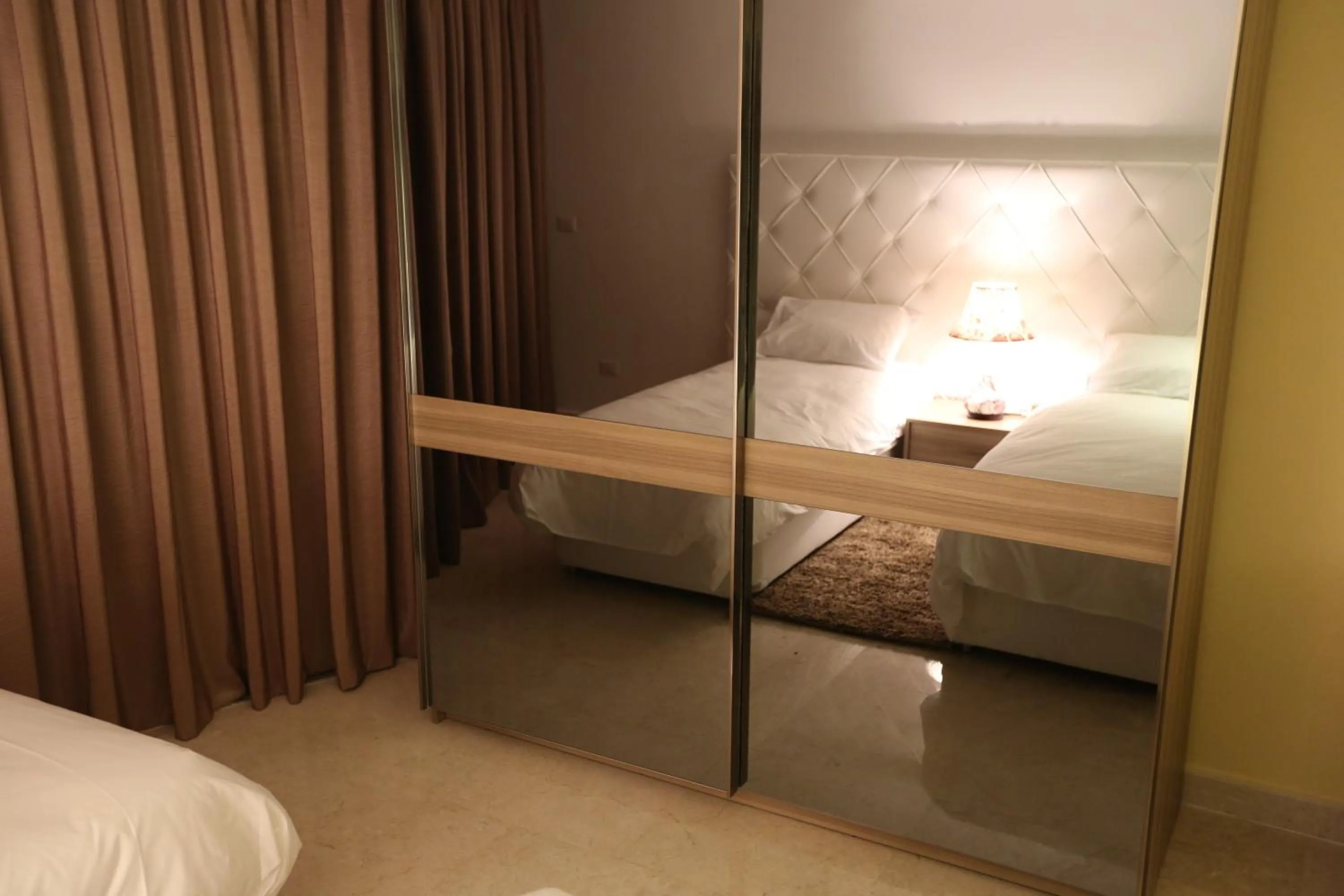 Bed in Delora Hotel and Suites