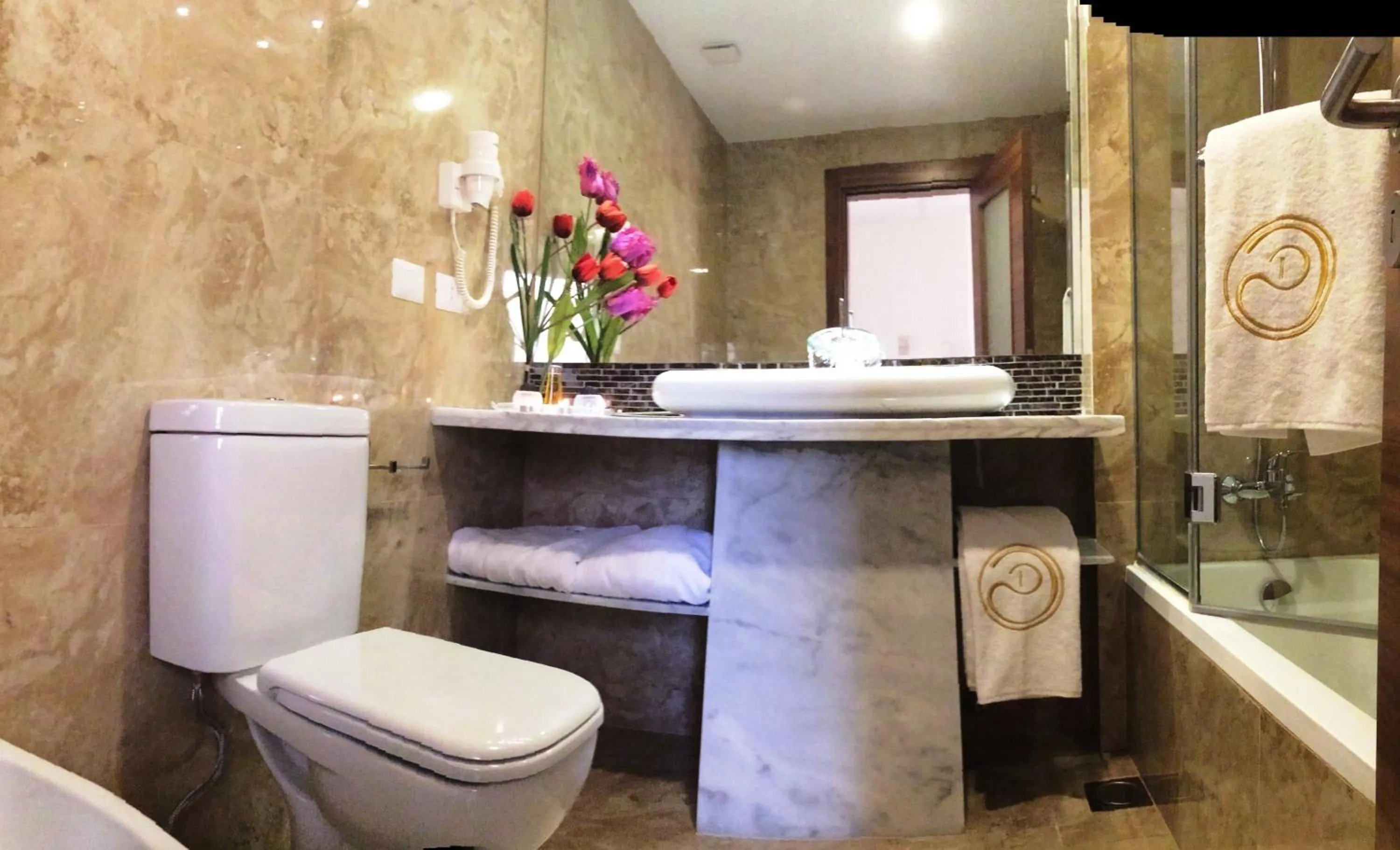 Bathroom in Delora Hotel and Suites