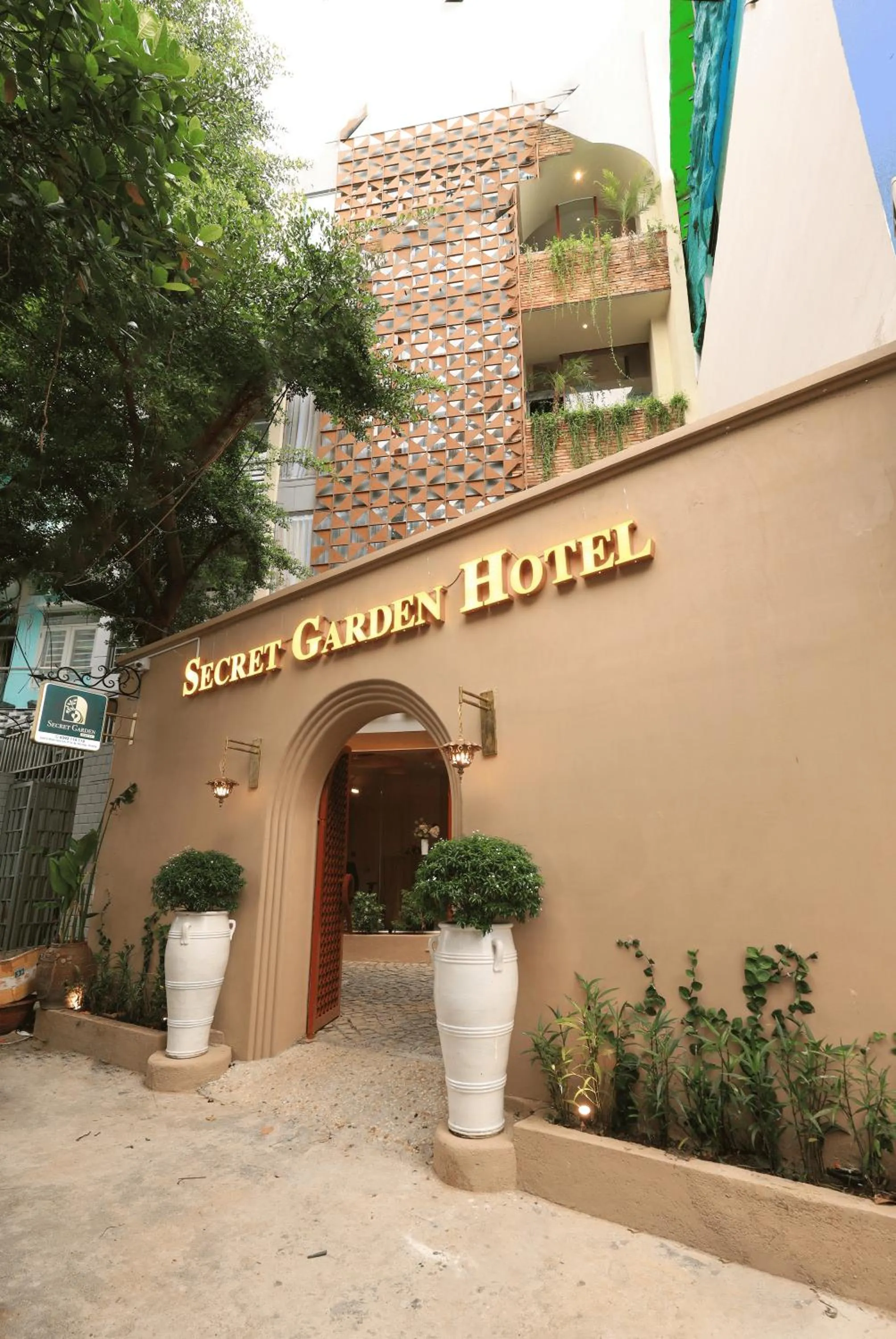 Property logo or sign in Secret Garden Hotel