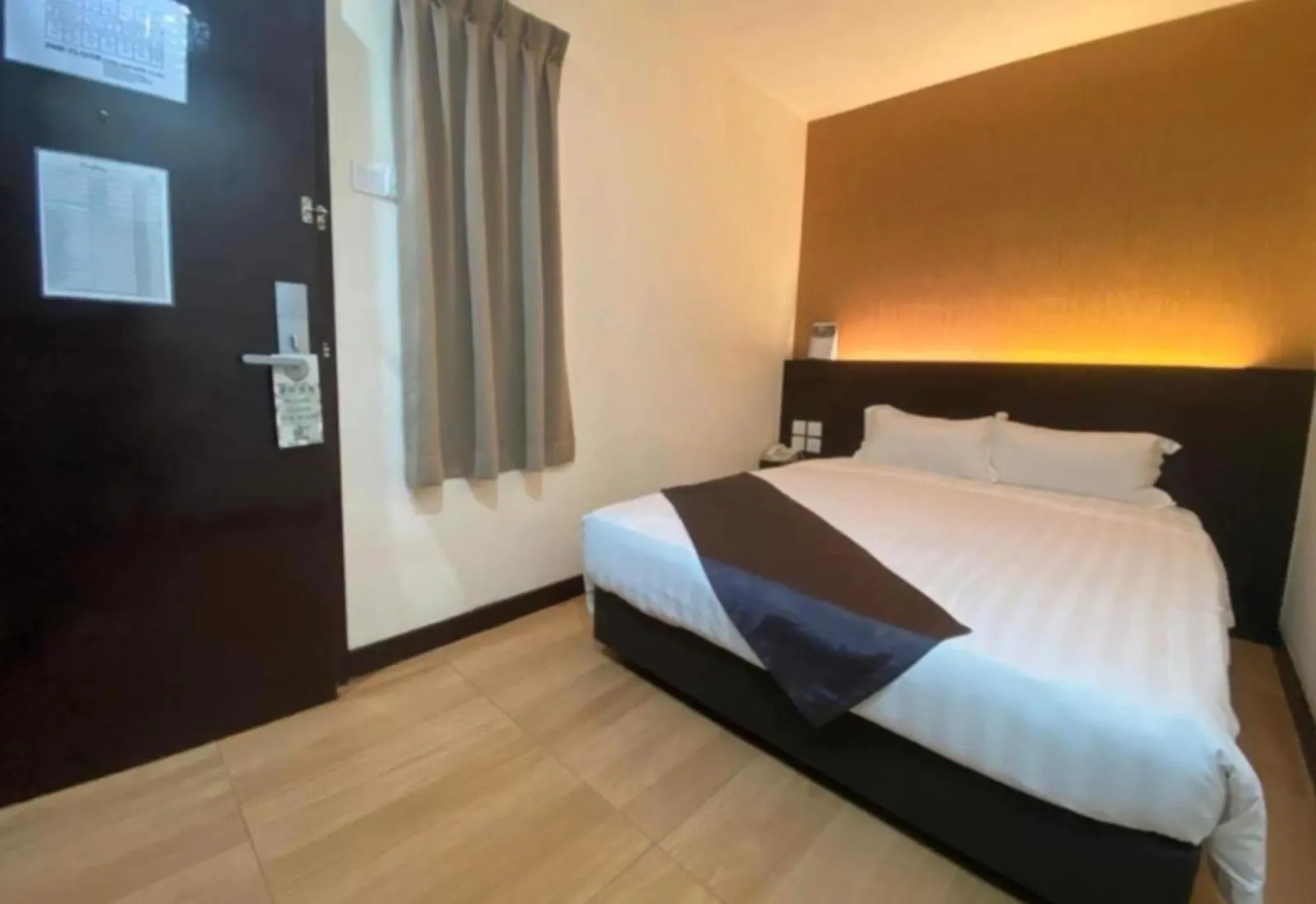 Bedroom in Hotel EzzyHome Kebun Teh