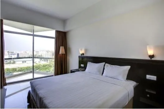 Bed in Ocean Paradise Hotel and Resort