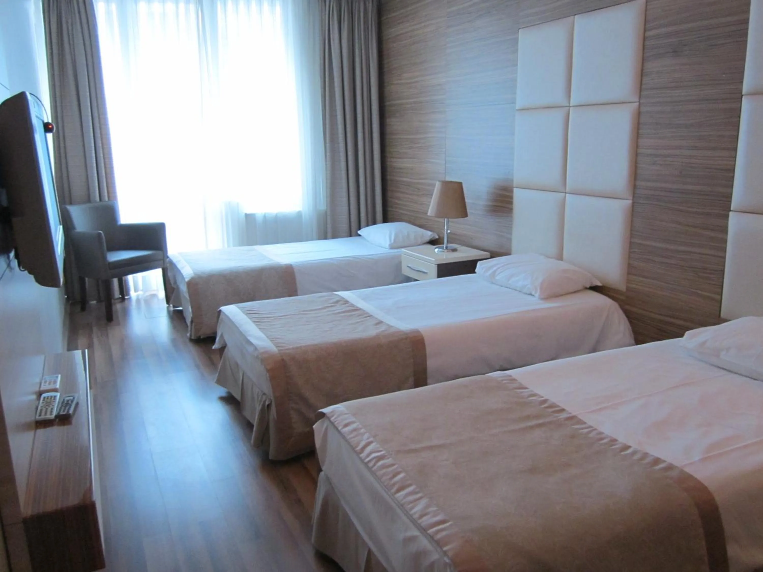 Bed in Derpa Suite Hotel