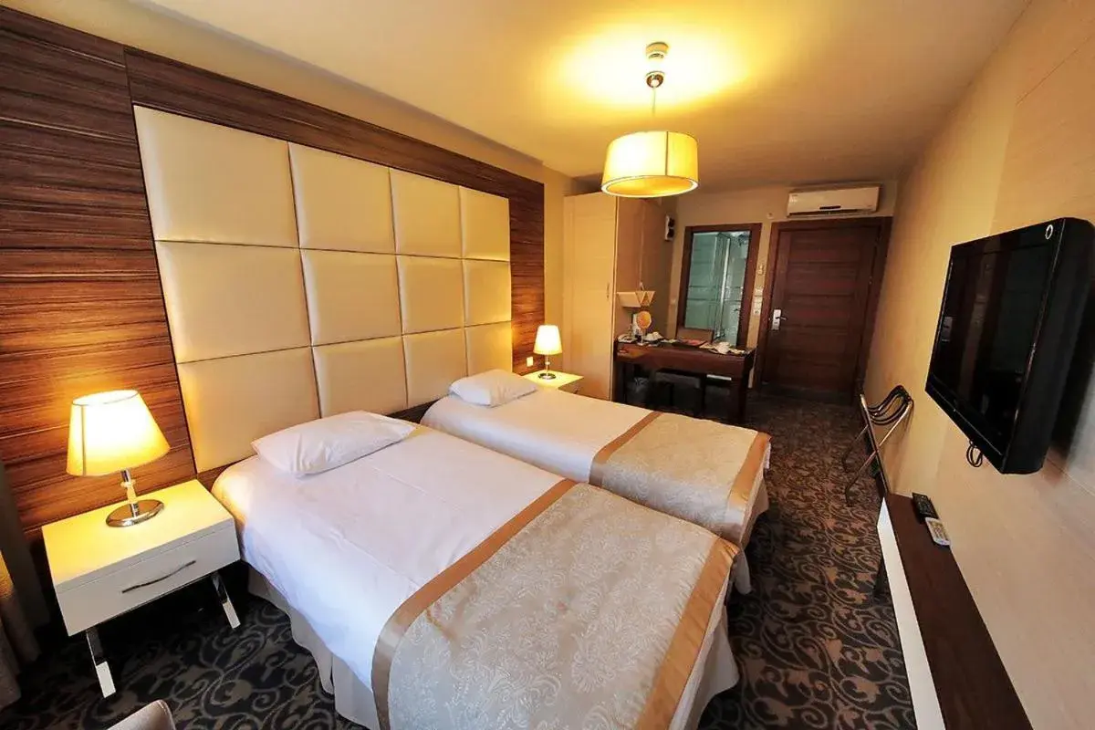 Bed in Derpa Suite Hotel Bed in Derpa Suite Hotel