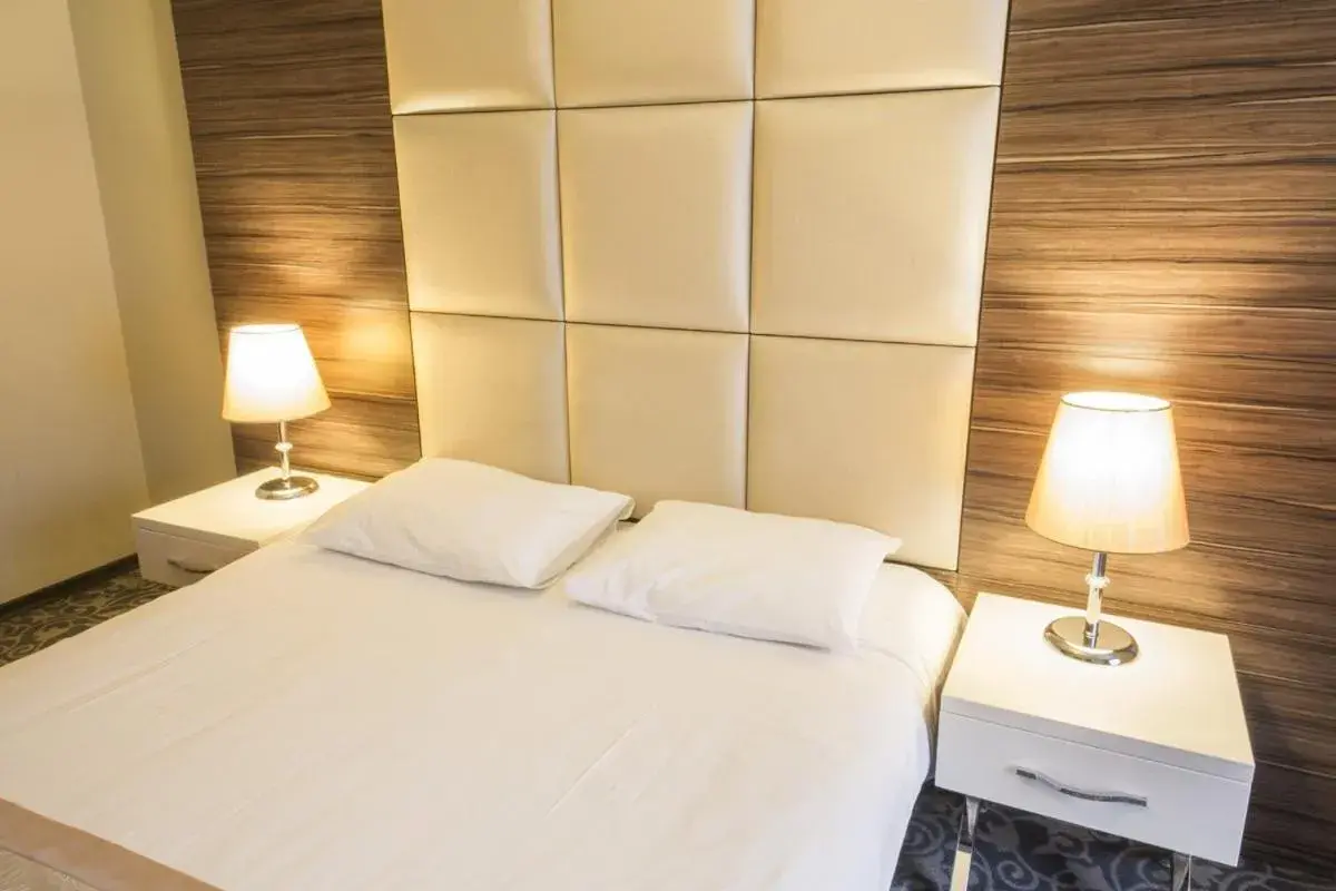 Bed in Derpa Suite Hotel Bed in Derpa Suite Hotel