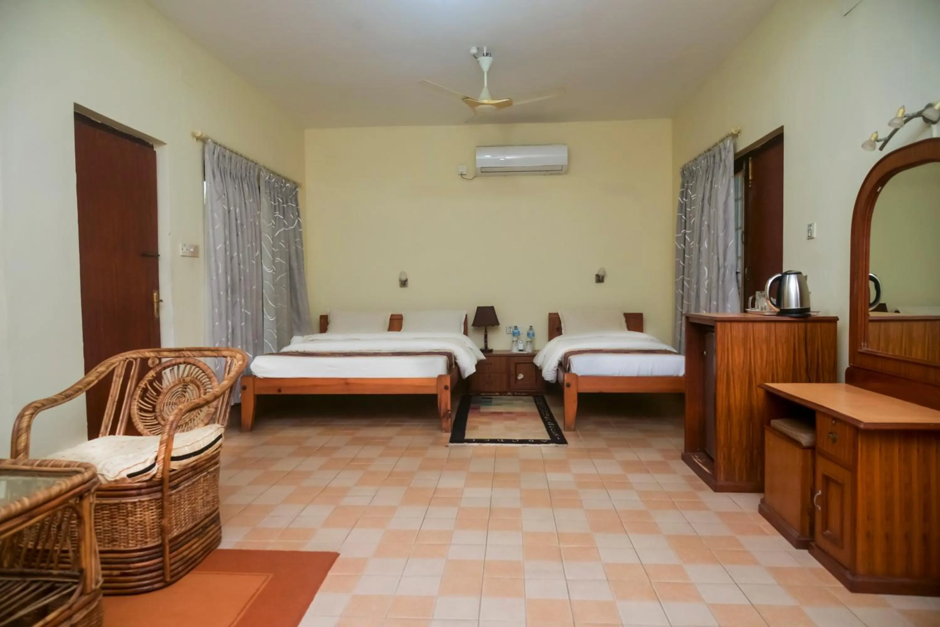 Photo of the whole room, Bed in Chitwan Paradise Hotel